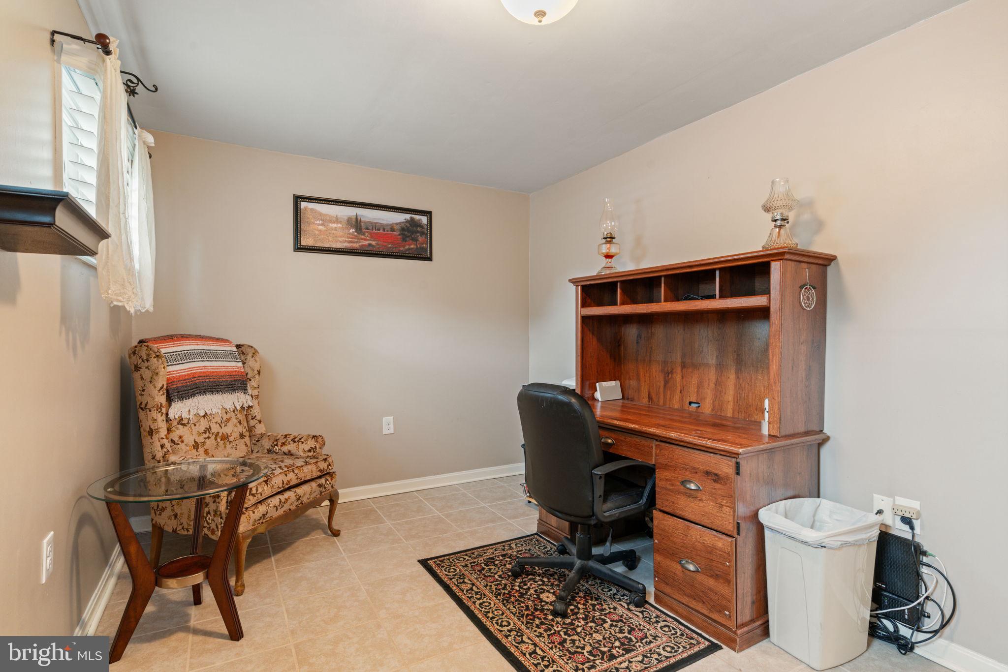 7610 Bland Drive Manassas, VA 20109 - Photo 30 of 43 a room with a chair and gym equipment