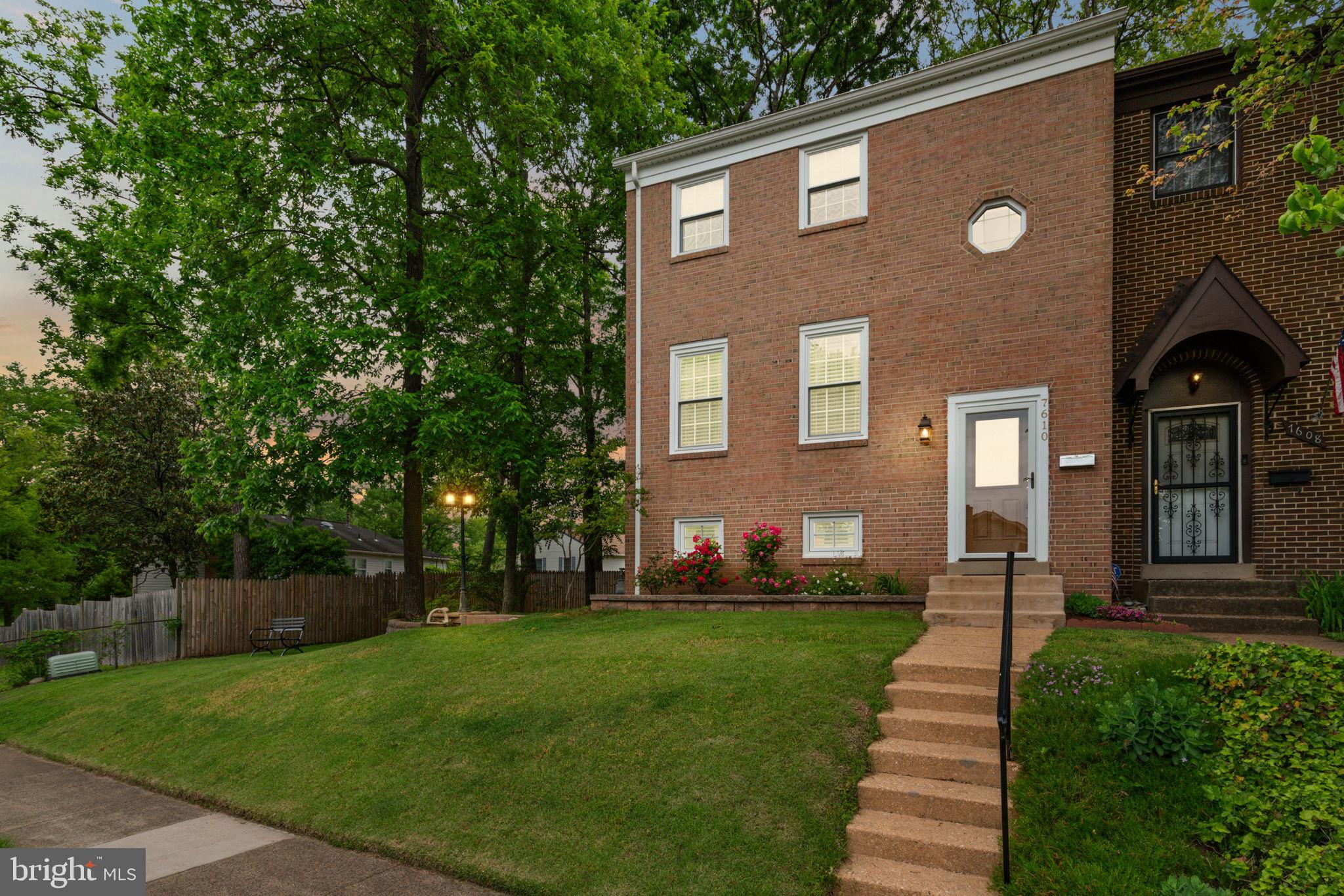 7610 Bland Drive Manassas, VA 20109 - Photo 3 of 43 a front view of a house with garden
