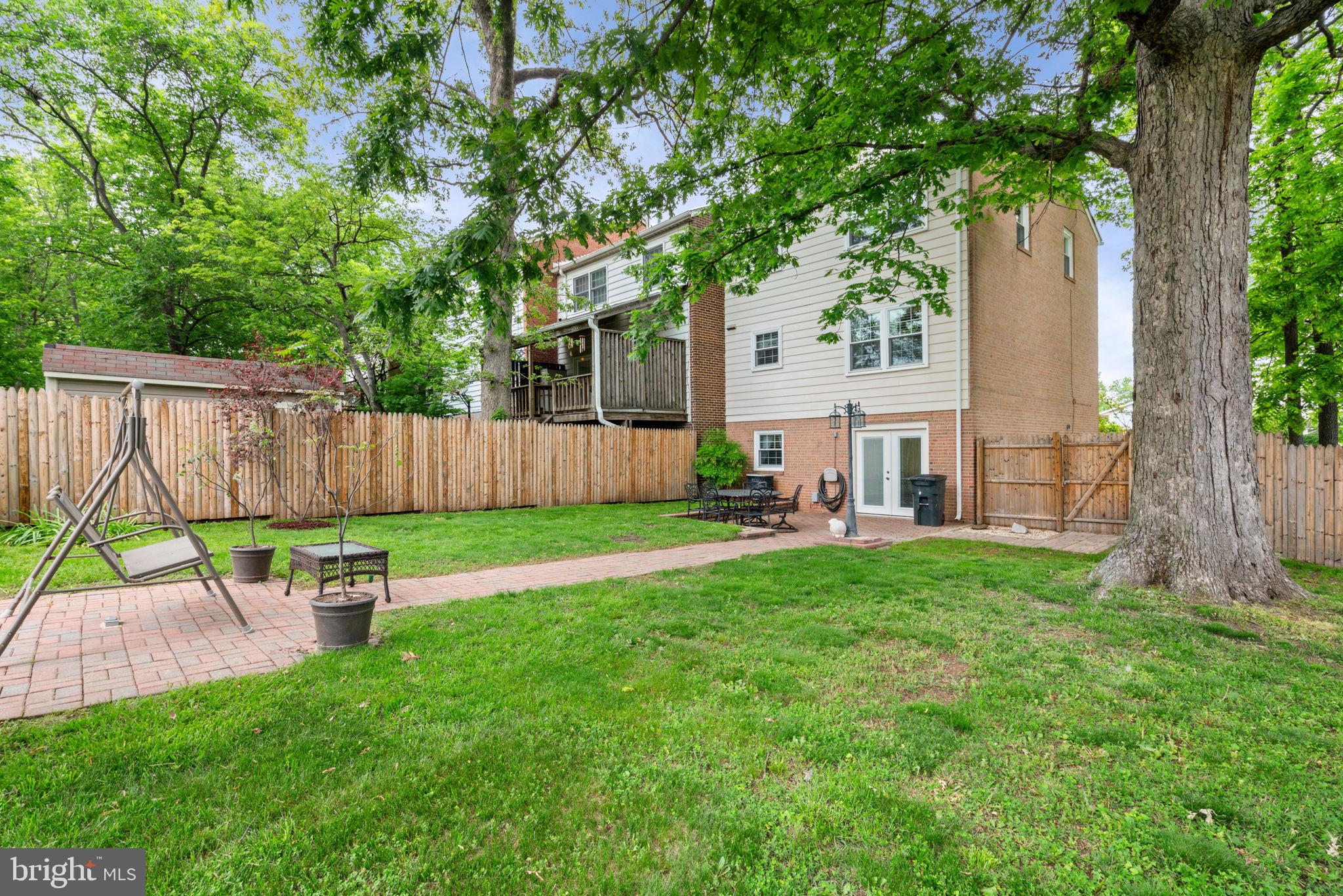 7610 Bland Drive Manassas, VA 20109 - Photo 36 of 43 a backyard of a house with table and chairs