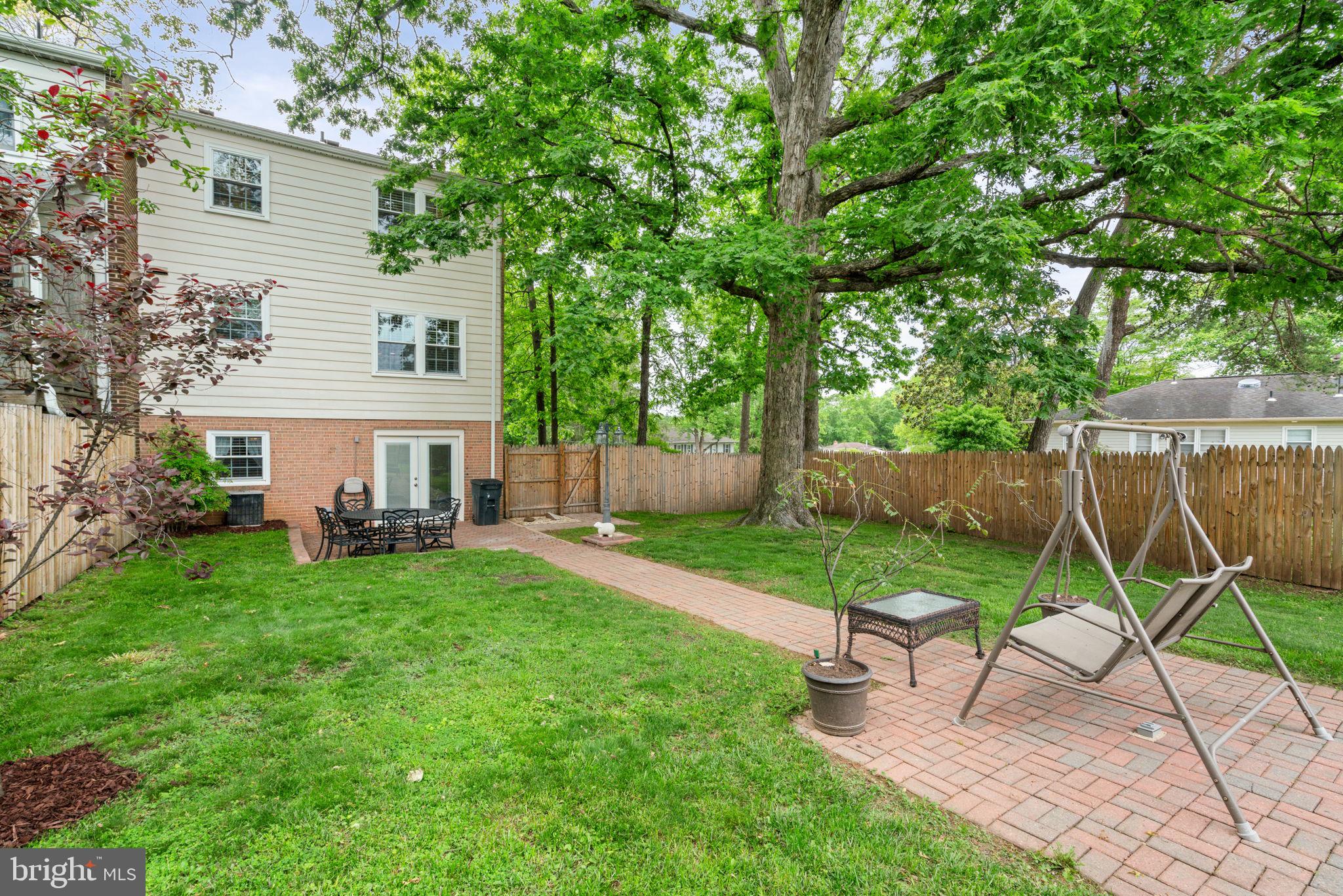 7610 Bland Drive Manassas, VA 20109 - Photo 38 of 43 a view of a house with a yard and sitting area