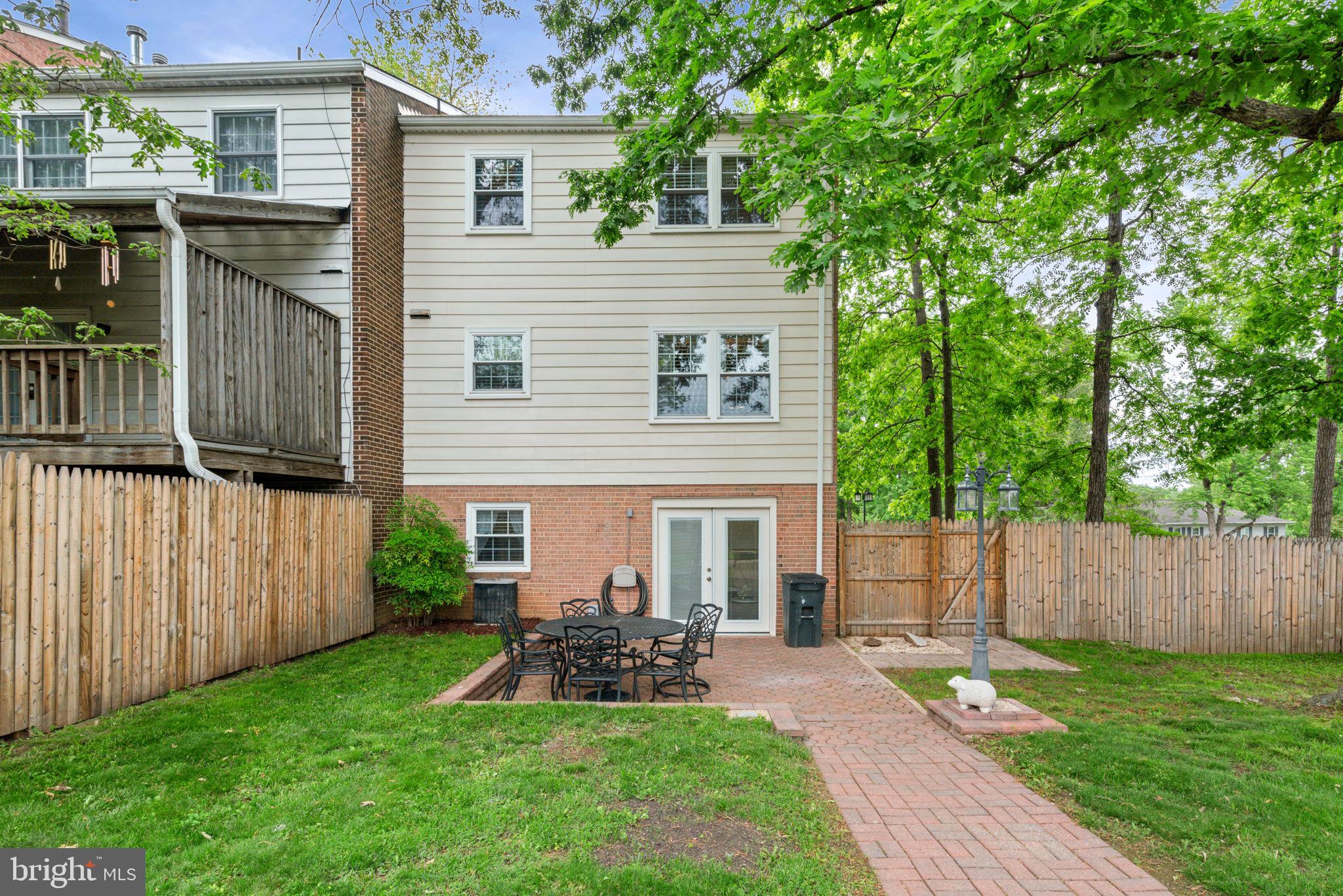 7610 Bland Drive Manassas, VA 20109 - Photo 39 of 43 a view of a house with a yard and sitting area