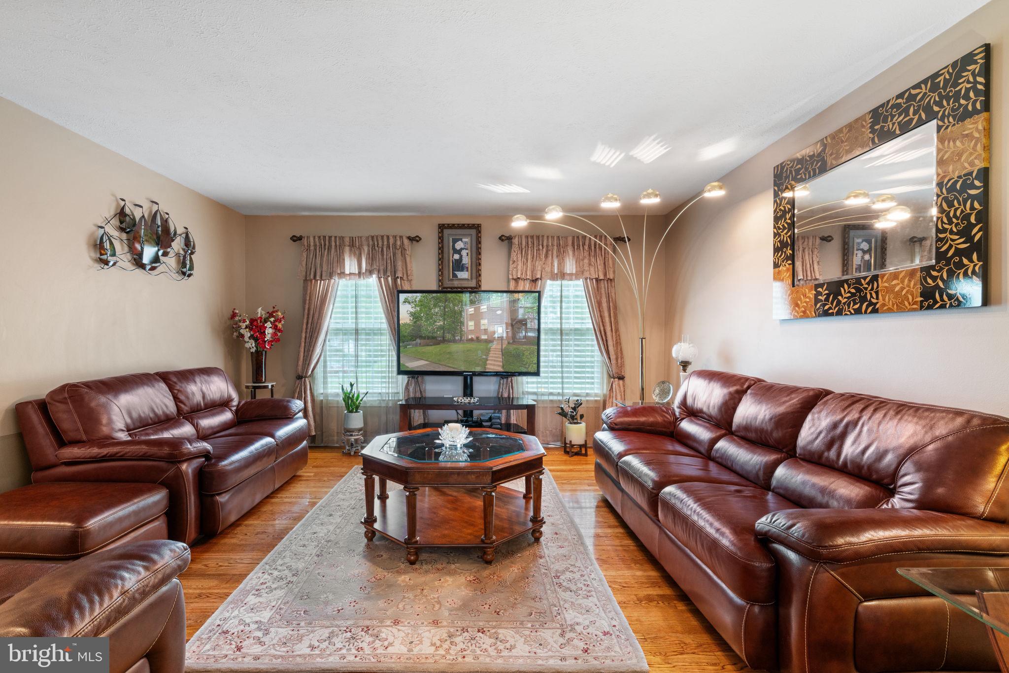 7610 Bland Drive Manassas, VA 20109 - Photo 6 of 43 a living room with furniture and a large window