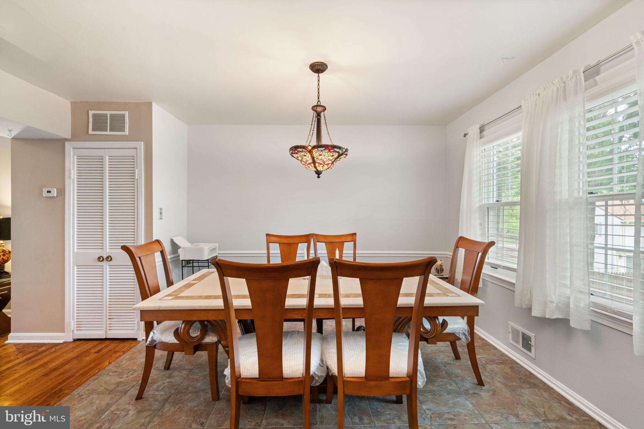 7610 Bland Drive Manassas, VA 20109 - Photo 9 of 43 a view of a dining room with furniture window and wooden floor
