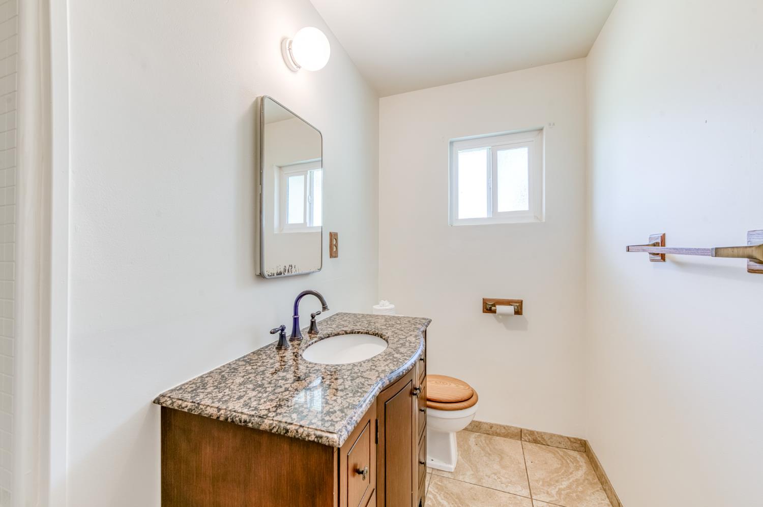 8625 La Vaca Way Hanford, CA 93230 - Photo 14 of 33 a bathroom with a granite countertop sink toilet and mirror