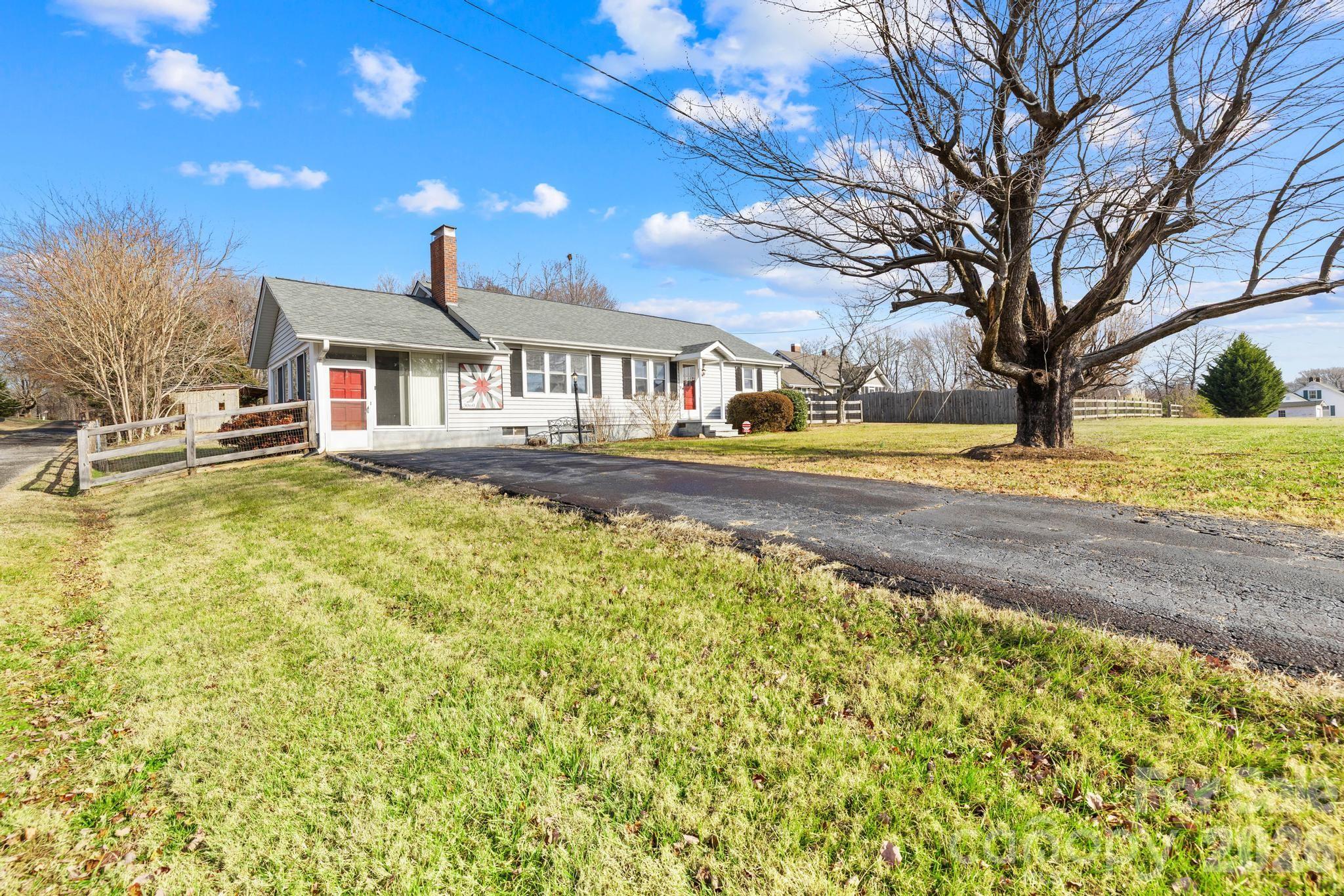 3060 Poplar Springs Road State Road, NC 28676 - Photo 13 of 38 a front view of a house with a yard