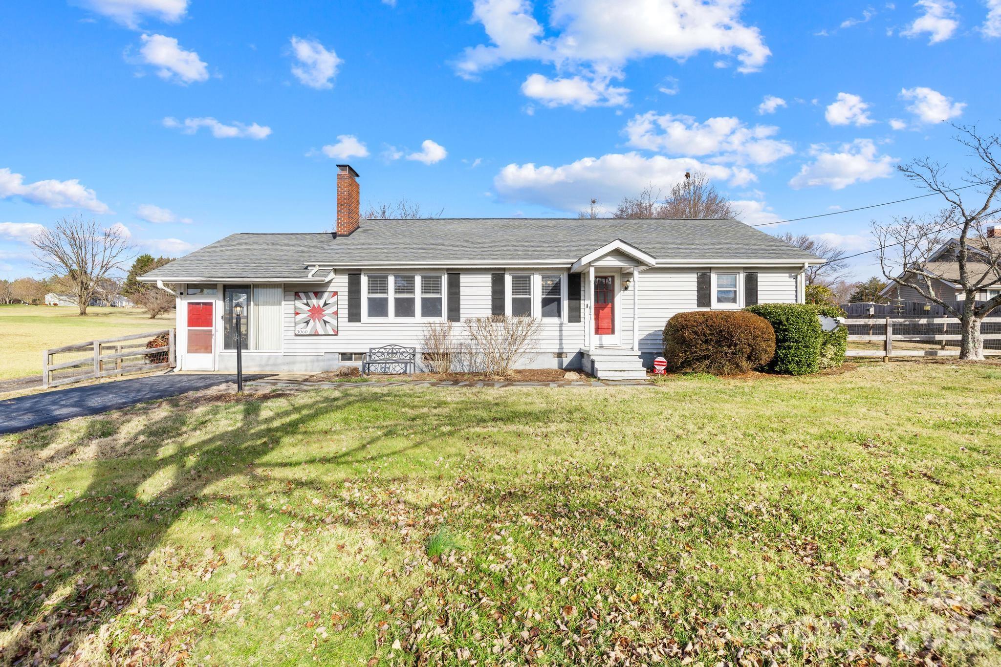 3060 Poplar Springs Road State Road, NC 28676 - Photo 14 of 38 a front view of a house with a yard