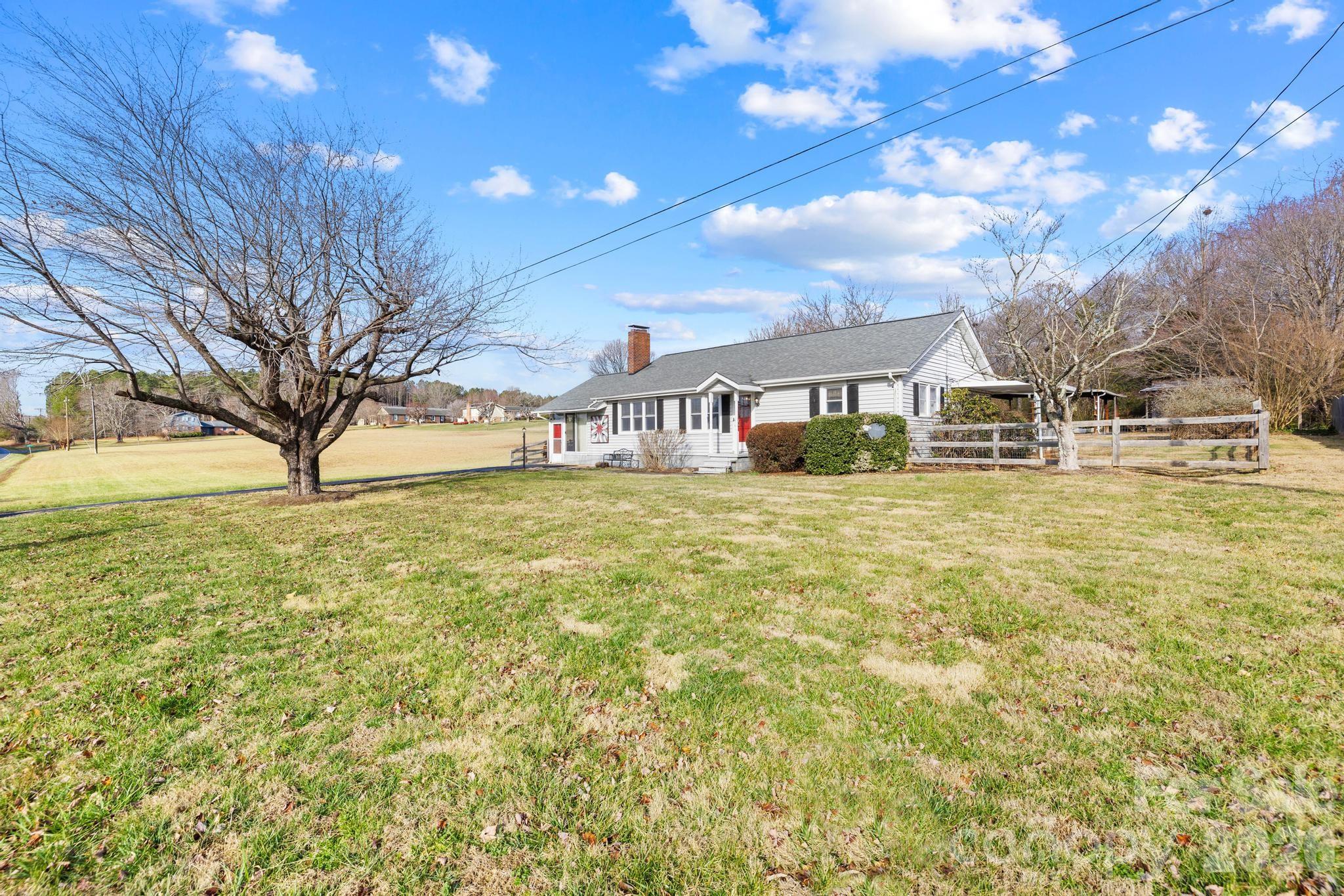 3060 Poplar Springs Road State Road, NC 28676 - Photo 15 of 38 a large house with swimming pool in front of it