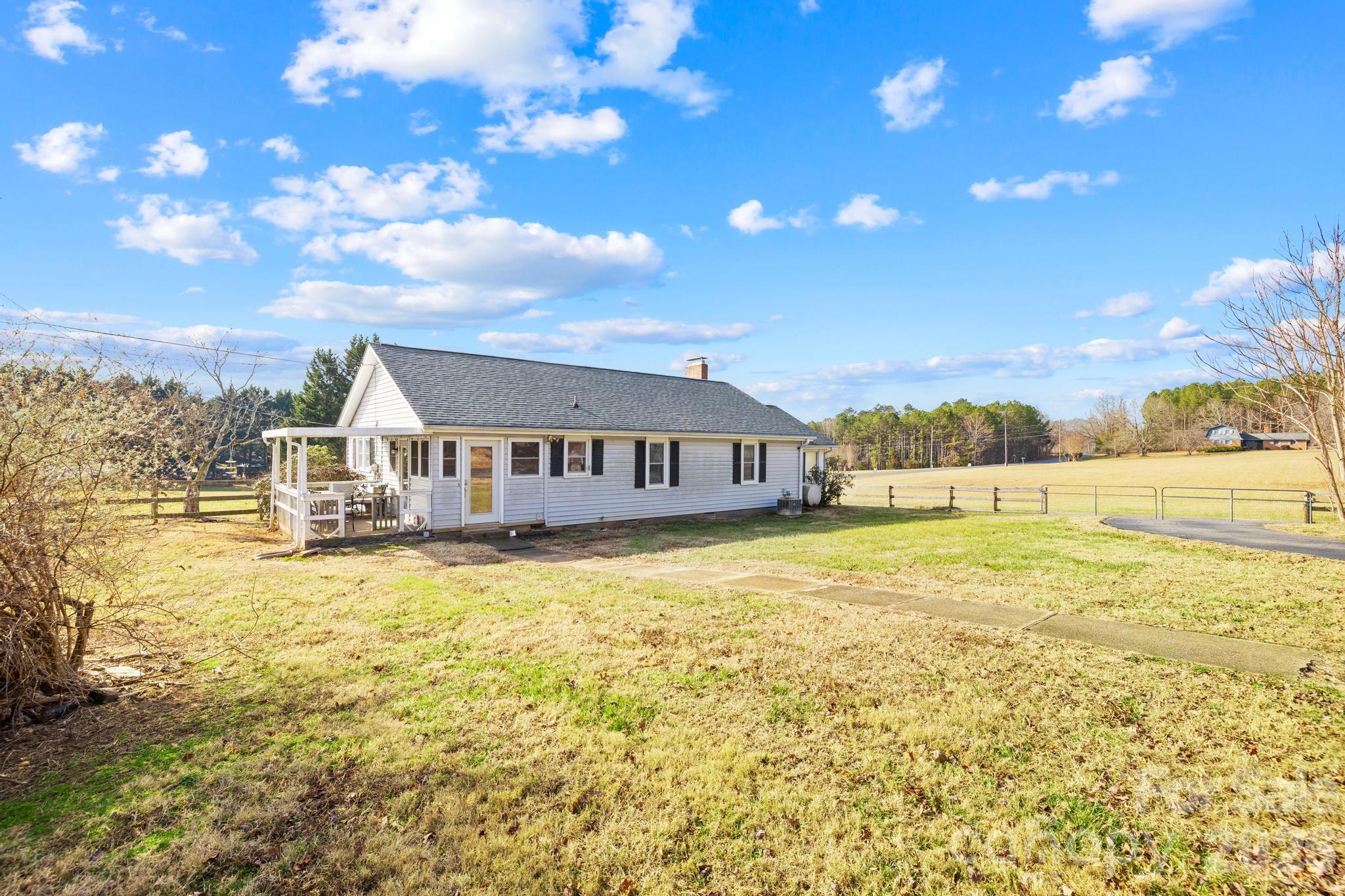 3060 Poplar Springs Road State Road, NC 28676 - Photo 18 of 38 a front view of house with yard and ocean view