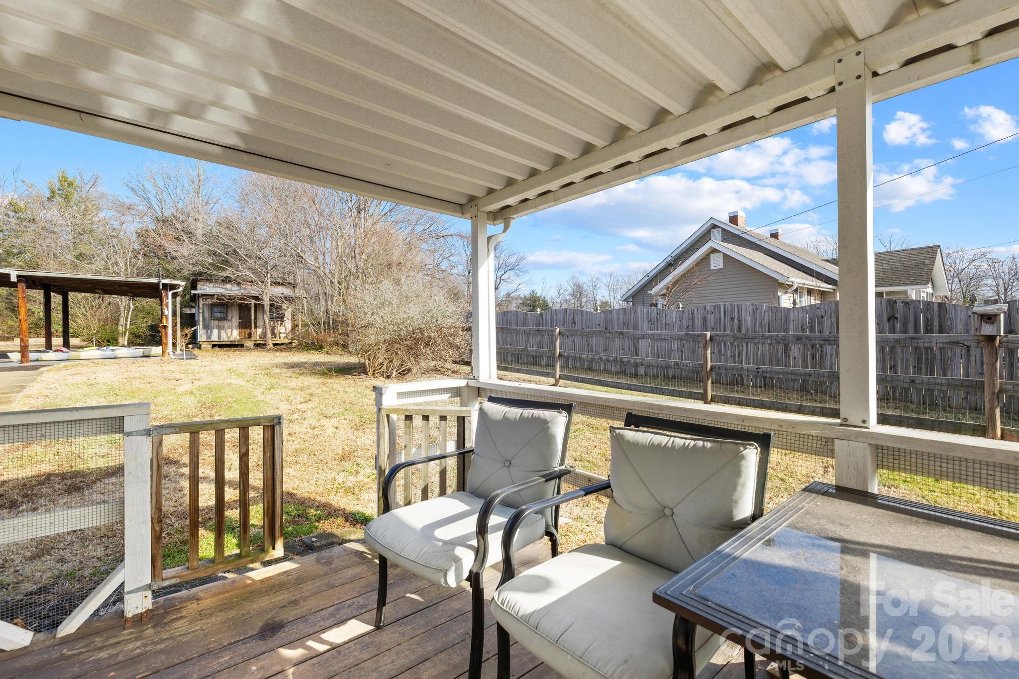 3060 Poplar Springs Road State Road, NC 28676 - Photo 21 of 38 a view of a patio with couches chairs and wooden floor