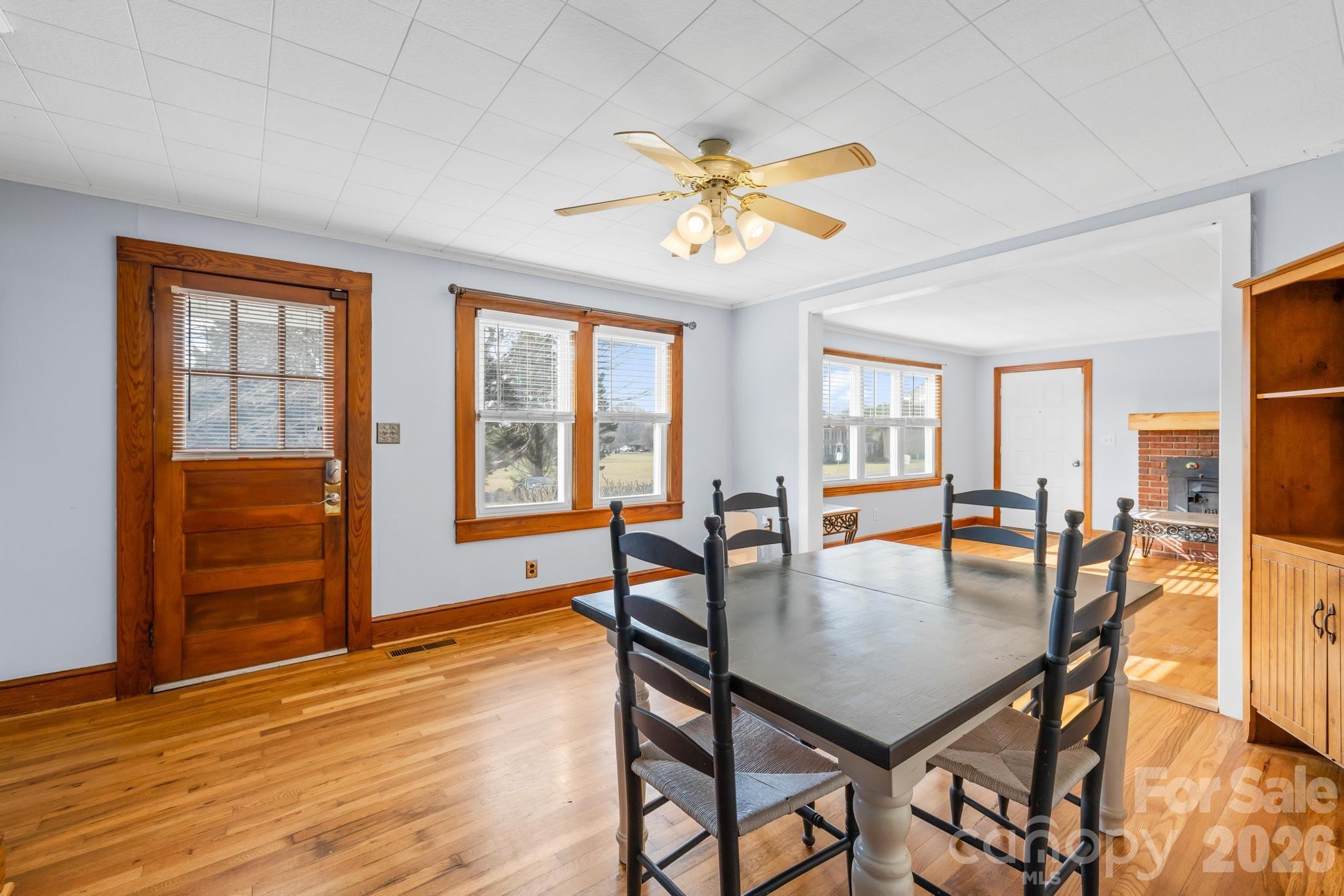 3060 Poplar Springs Road State Road, NC 28676 - Photo 27 of 38 a view of a dining room with furniture window and wooden floor