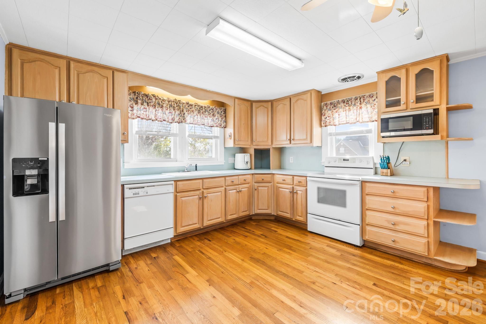 3060 Poplar Springs Road State Road, NC 28676 - Photo 28 of 38 a kitchen with stainless steel appliances a refrigerator sink and cabinets
