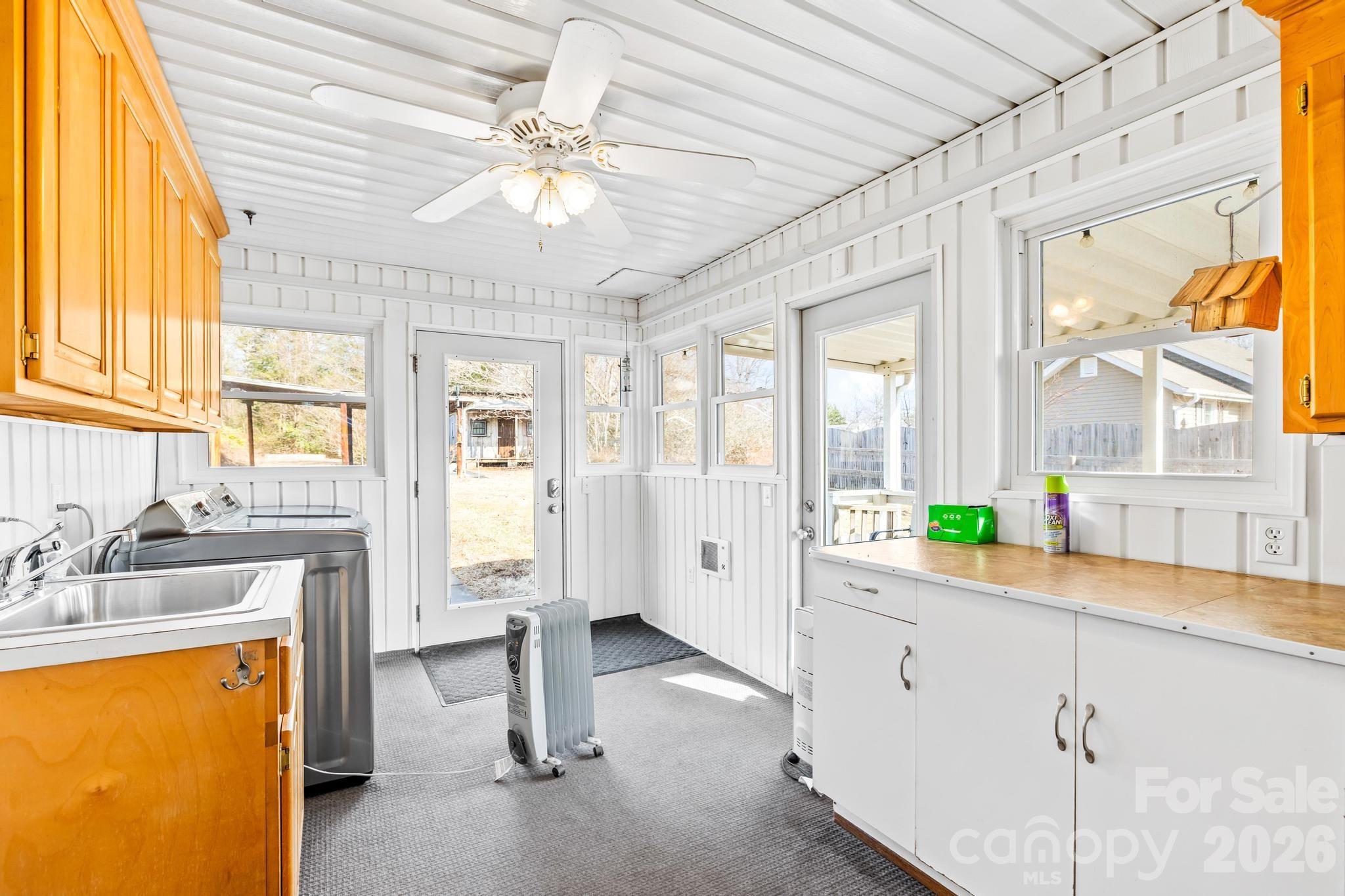 3060 Poplar Springs Road State Road, NC 28676 - Photo 31 of 38 a view of a kitchen with a sink and cabinets
