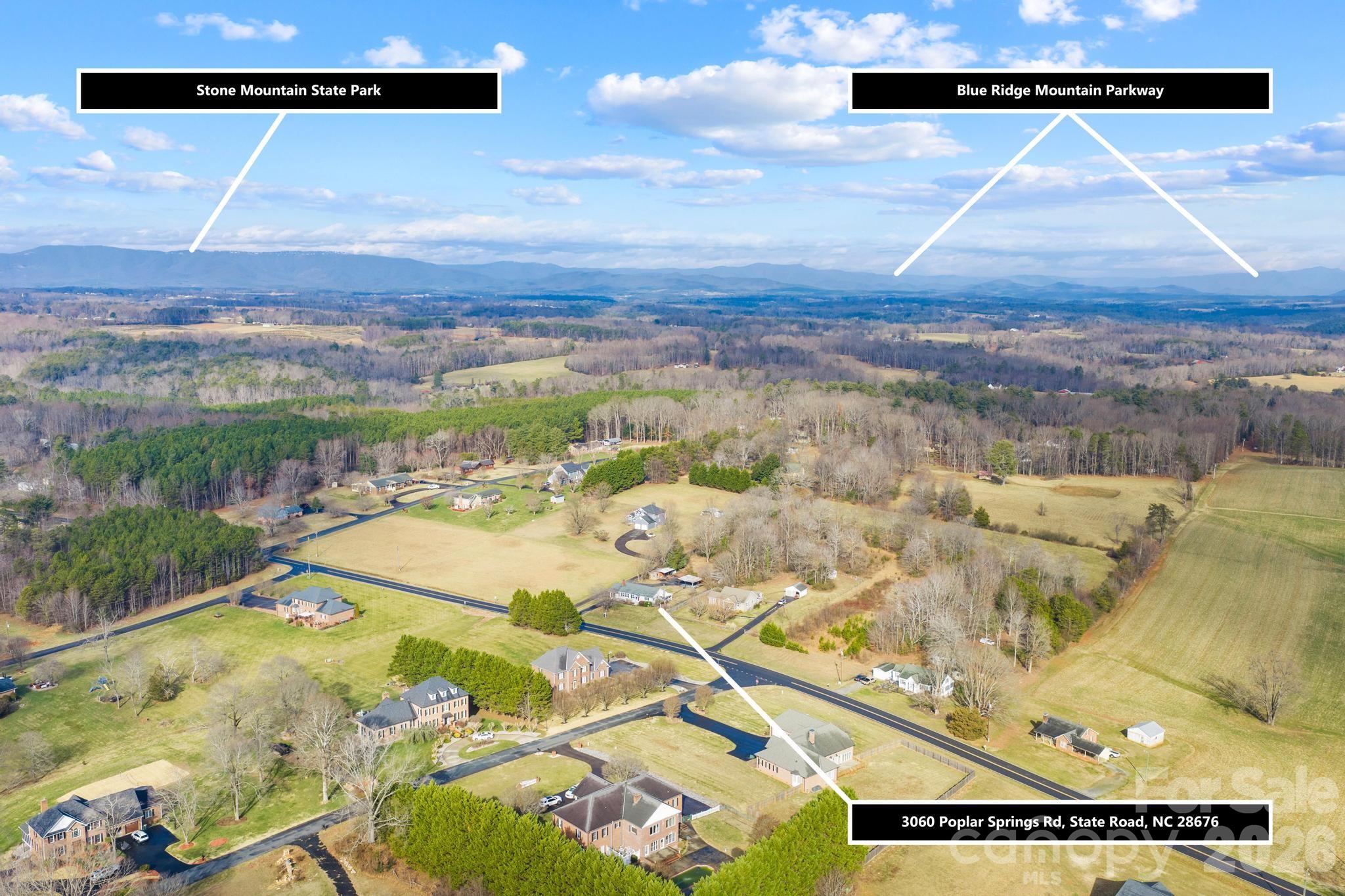 3060 Poplar Springs Road State Road, NC 28676 - Photo 7 of 38 a view of a swimming pool and an outdoor space