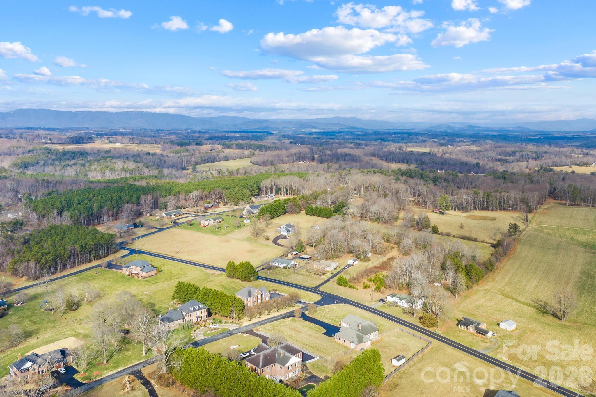 3060 Poplar Springs Road State Road, NC 28676 - Photo 8 of 38 an aerial view of residential houses with outdoor space