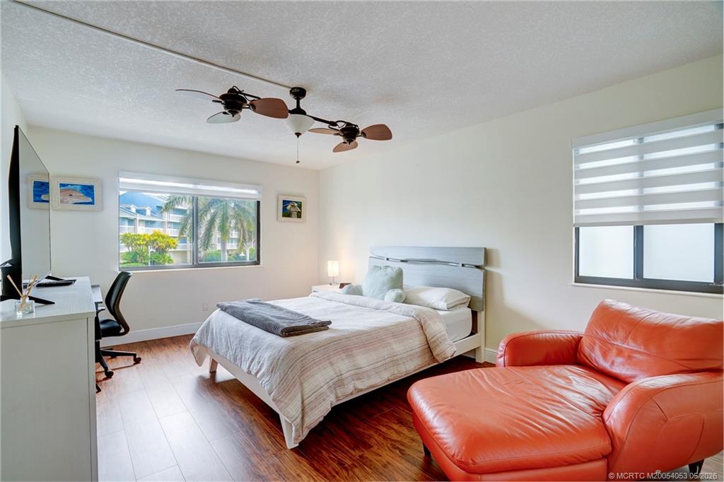 10 Northeast Plantation Road, Unit 101 Jensen Beach, FL 34957 - Photo 14 of 53 a bedroom with two beds and a window