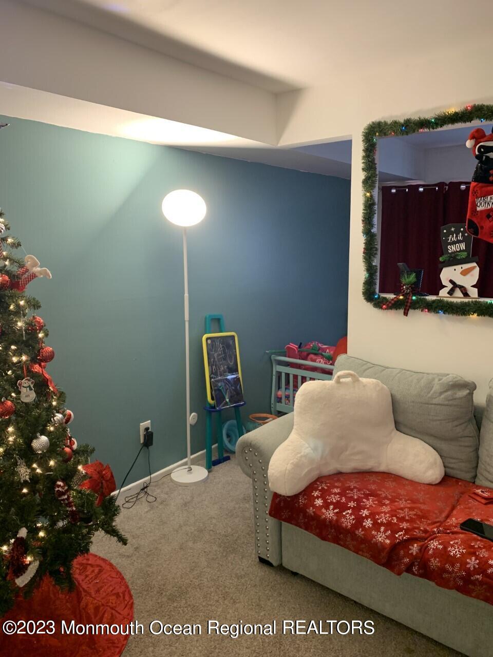 C19 Avon Drive East Windsor, NJ 08520 - Photo 1 of 2 a bedroom with a bed window and couch