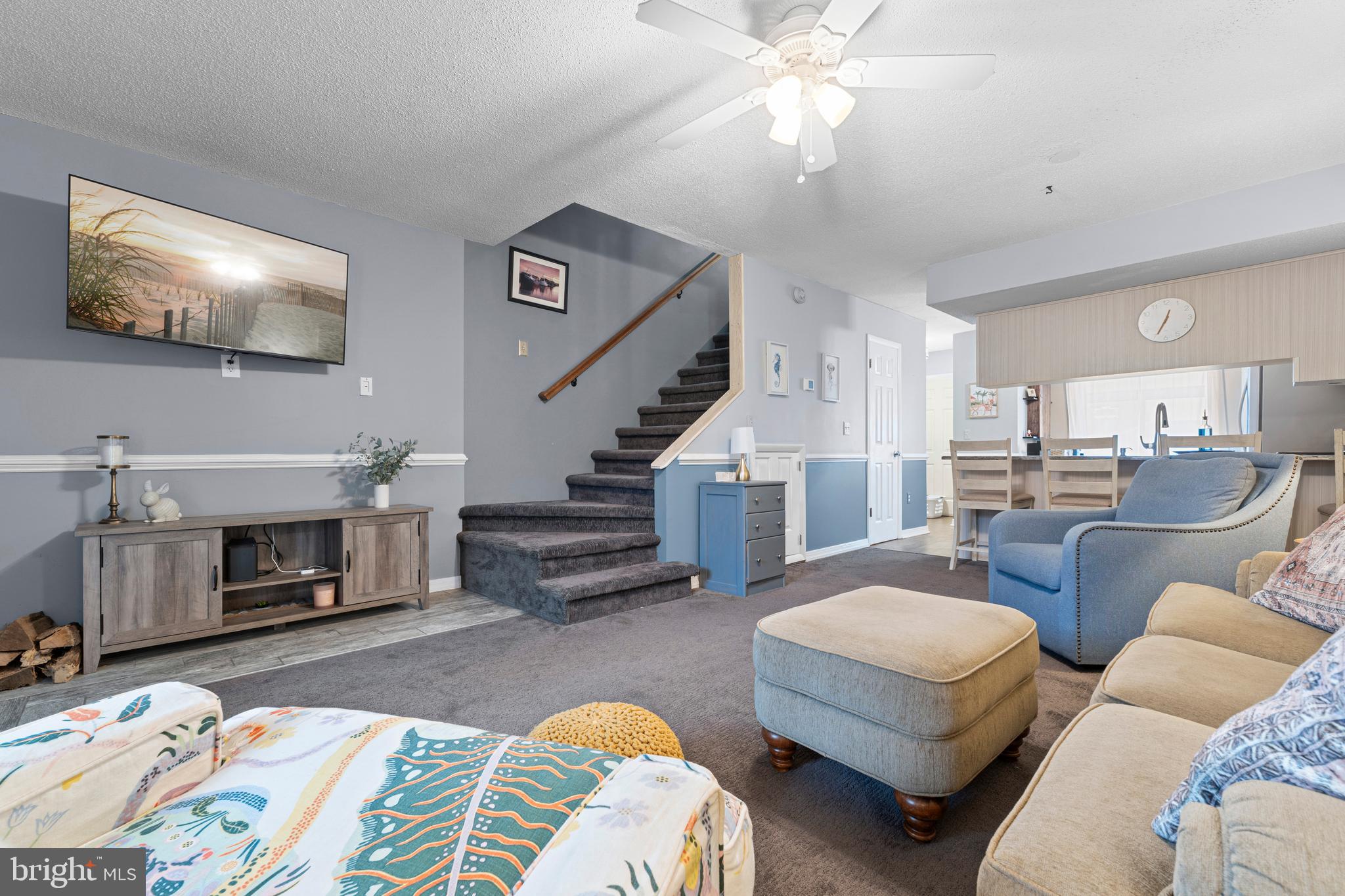 9815 Stephen Decatur Highway, Unit 14 Ocean City, MD 21842 - Photo 14 of 30 a living room with furniture and a flat screen tv