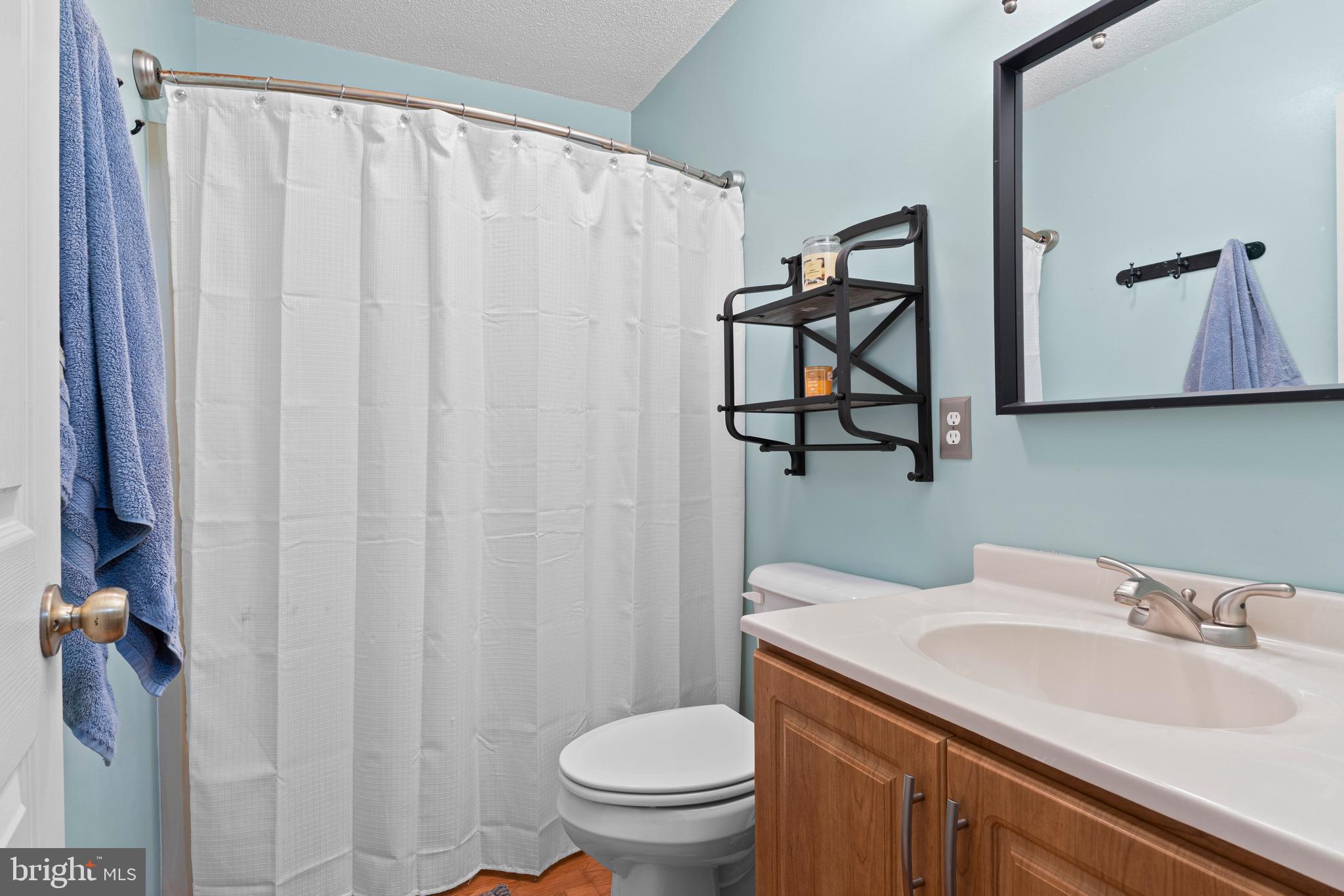 9815 Stephen Decatur Highway, Unit 14 Ocean City, MD 21842 - Photo 22 of 30 a bathroom with a sink toilet and shower