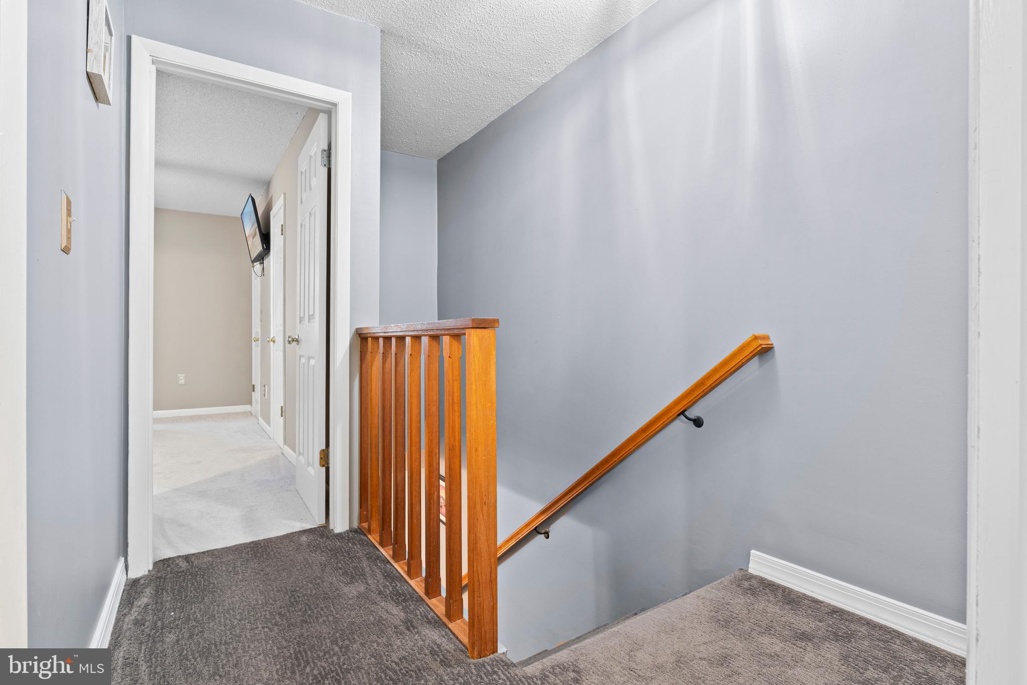 9815 Stephen Decatur Highway, Unit 14 Ocean City, MD 21842 - Photo 27 of 30 a view of a hallway with wooden floor and entryway