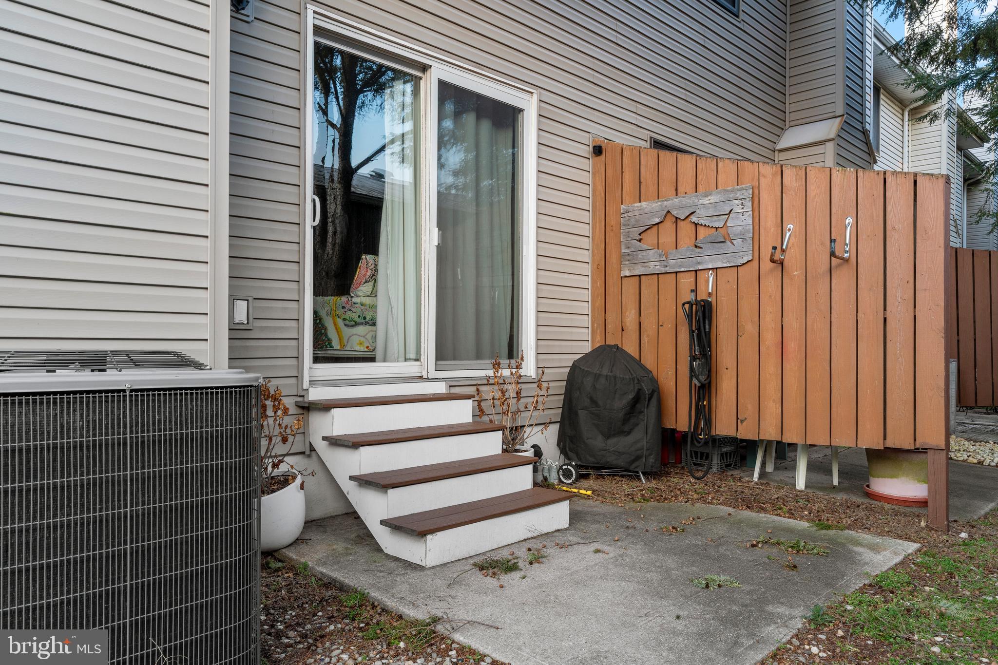 9815 Stephen Decatur Highway, Unit 14 Ocean City, MD 21842 - Photo 28 of 30 a view of a house with backyard and sitting area
