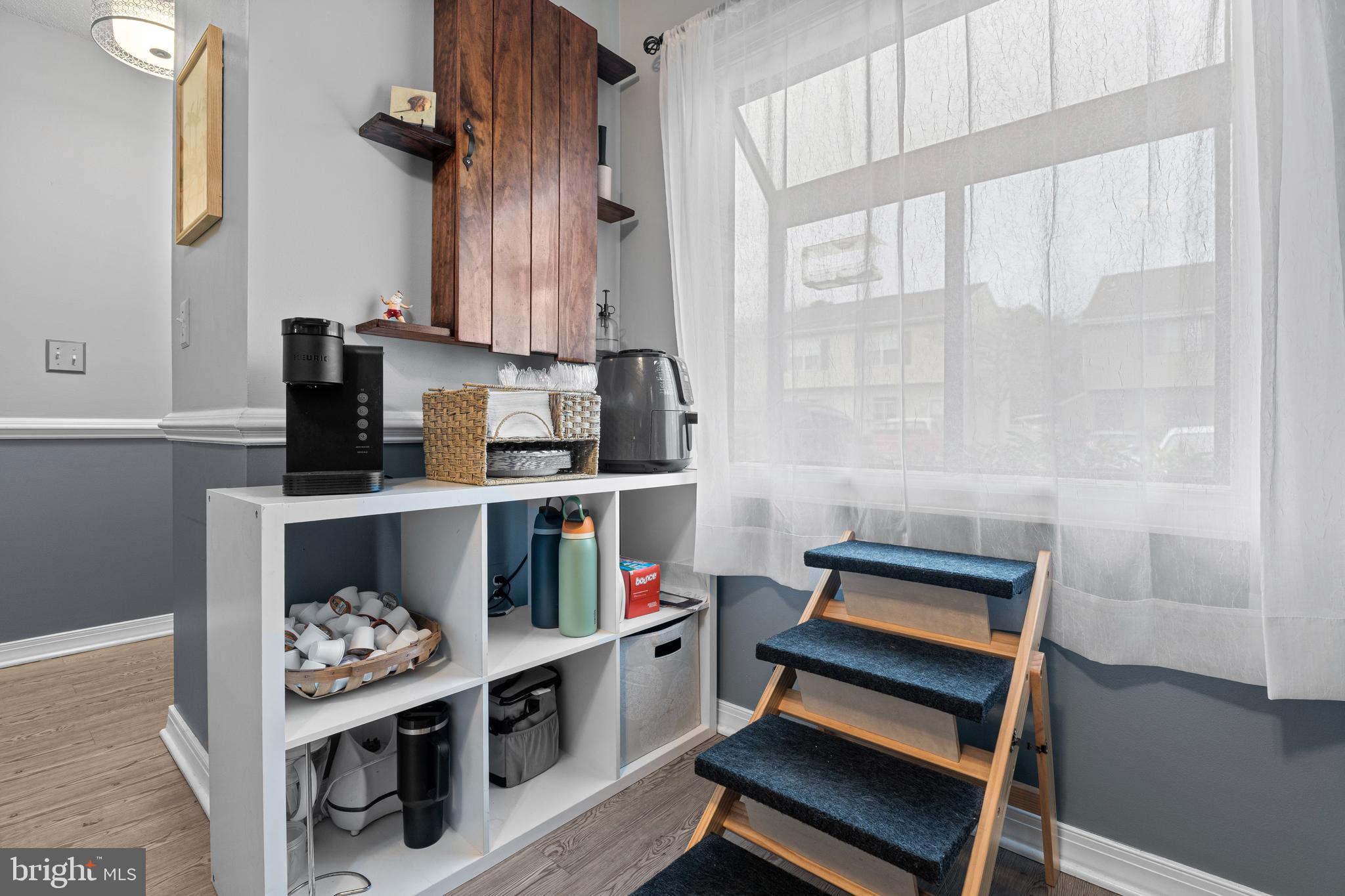 9815 Stephen Decatur Highway, Unit 14 Ocean City, MD 21842 - Photo 9 of 30 a room with furniture and a book shelf