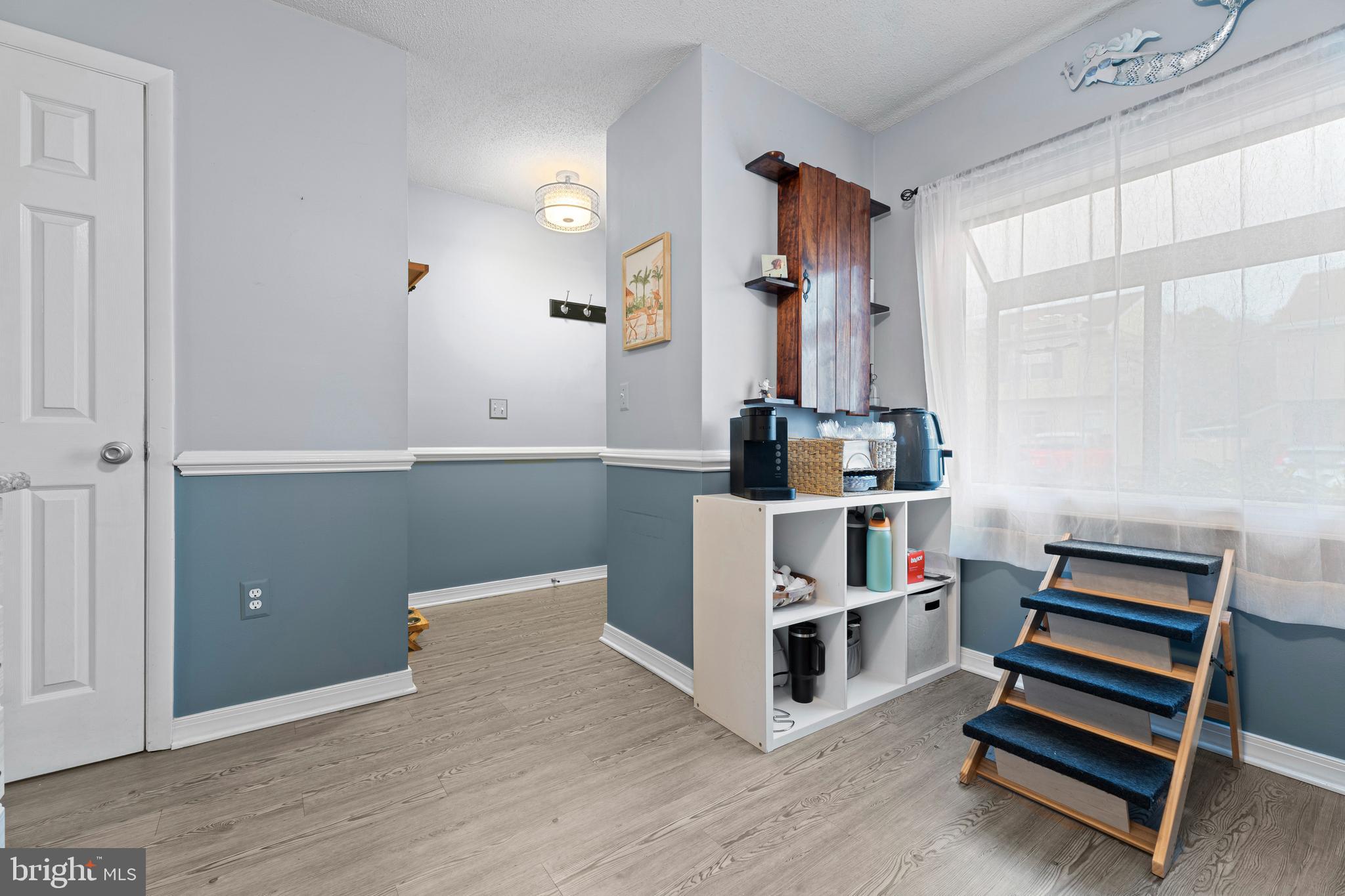 9815 Stephen Decatur Highway, Unit 14 Ocean City, MD 21842 - Photo 10 of 30 a room with furniture and wooden floor