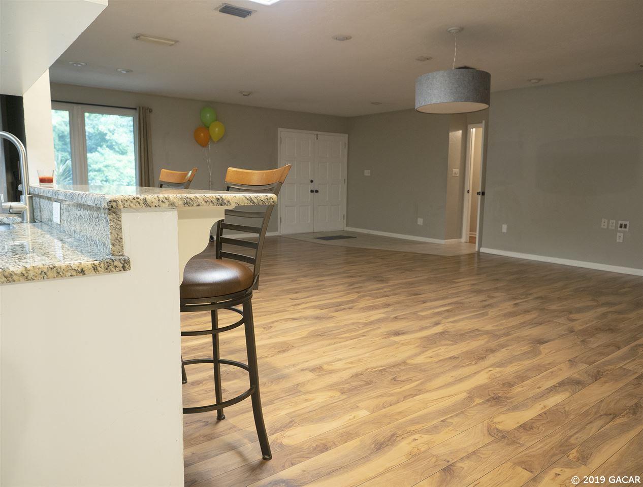 3745 Southwest 6th Place Gainesville, FL 32607 - Photo 4 of 22 View to entrance from kitchen