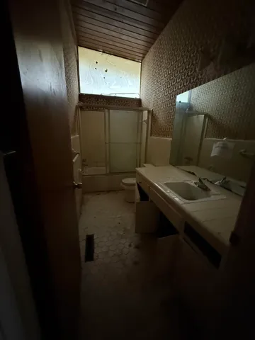 a bathroom with a sink and mirror
