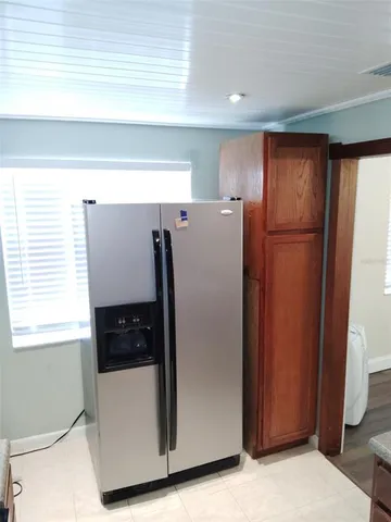 a white refrigerator freezer sitting in a kitchen