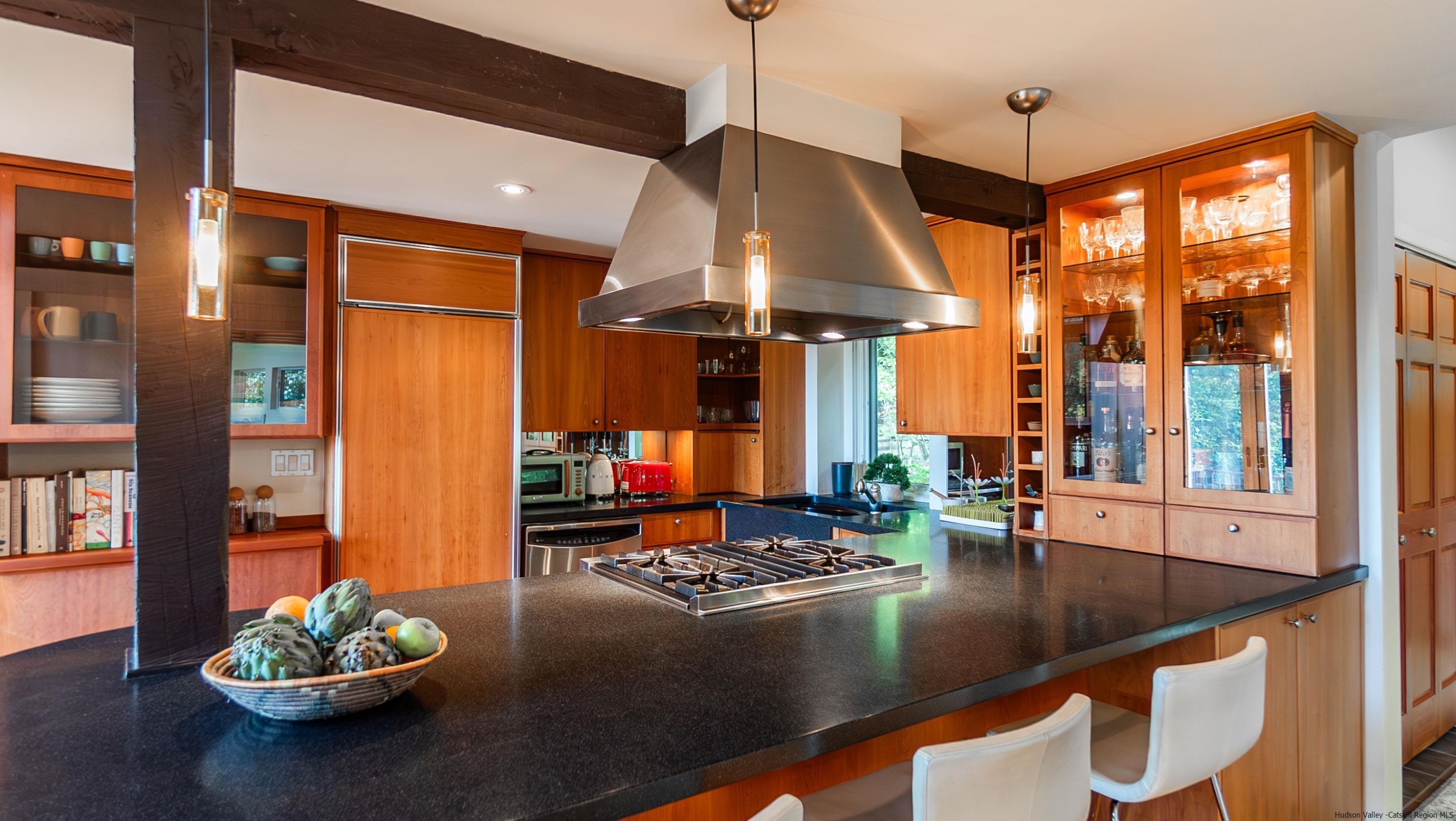 310 Jims Road Mount Tremper, NY 12457 - Photo 11 of 35 a kitchen with stainless steel appliances granite countertop a sink a stove and a wooden floor