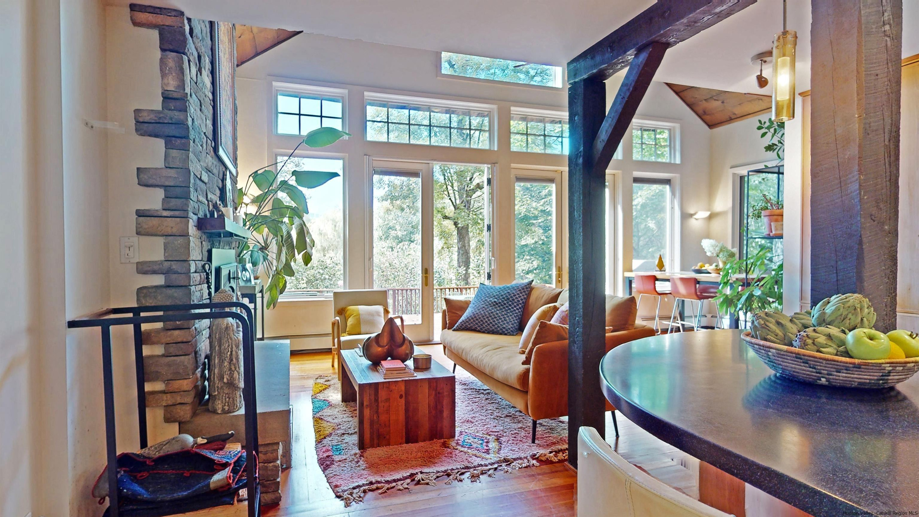 310 Jims Road Mount Tremper, NY 12457 - Photo 12 of 35 a living room with furniture and a potted plant