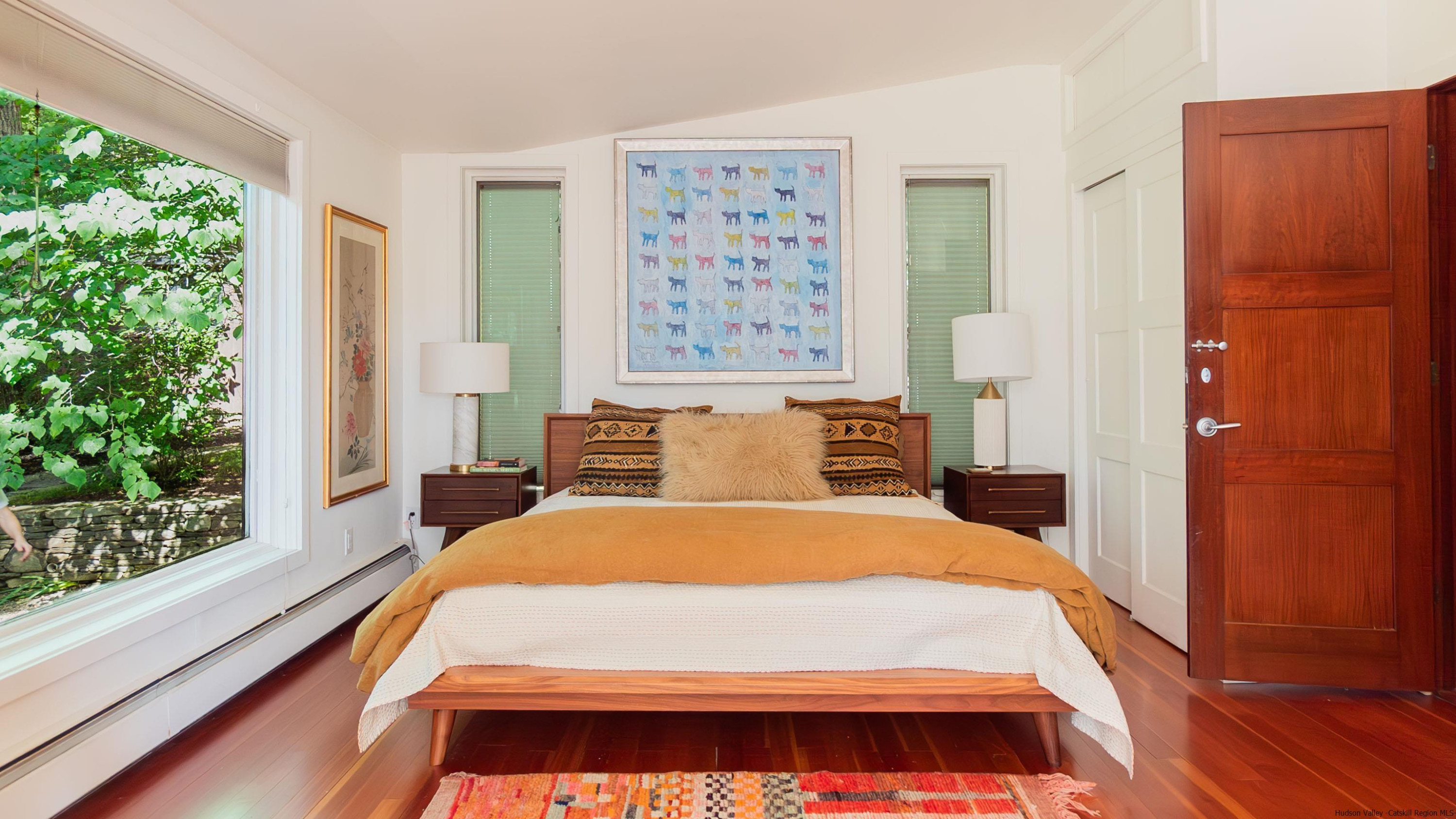 310 Jims Road Mount Tremper, NY 12457 - Photo 21 of 35 a bed sitting in a bedroom next to a window