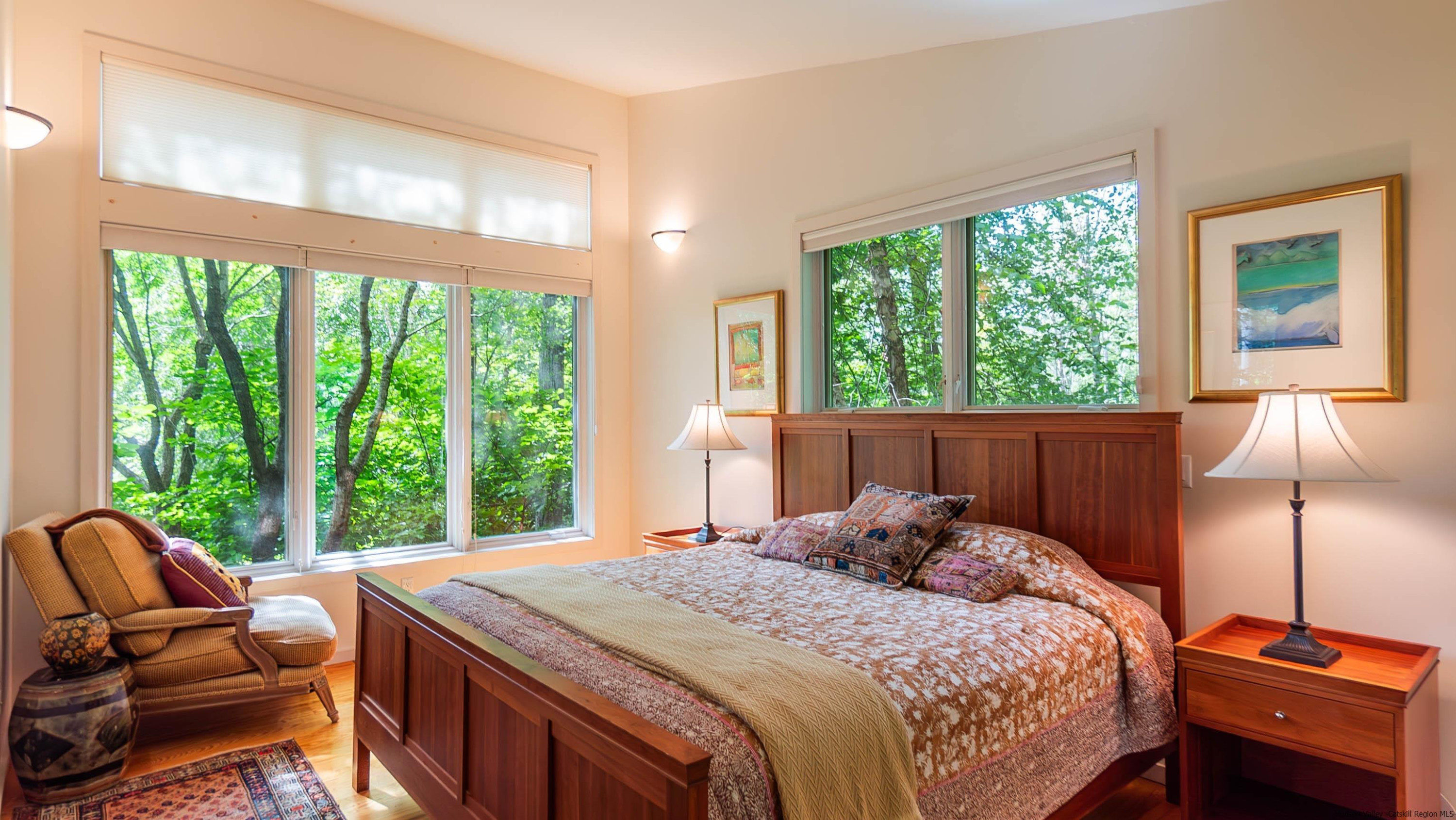 310 Jims Road Mount Tremper, NY 12457 - Photo 29 of 35 a bedroom with a bed and a large window