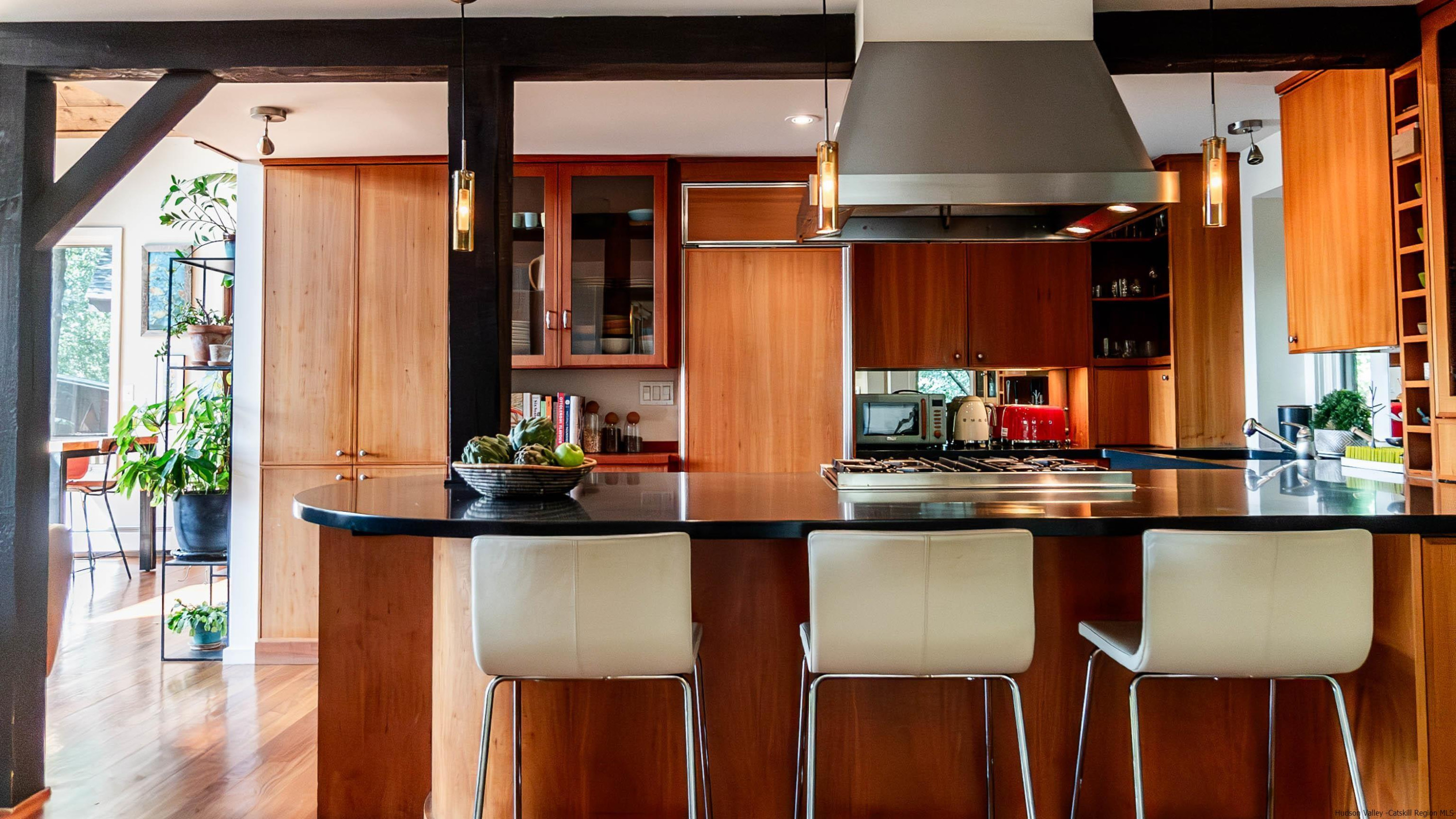 310 Jims Road Mount Tremper, NY 12457 - Photo 10 of 35 a kitchen with a table chairs refrigerator and sink
