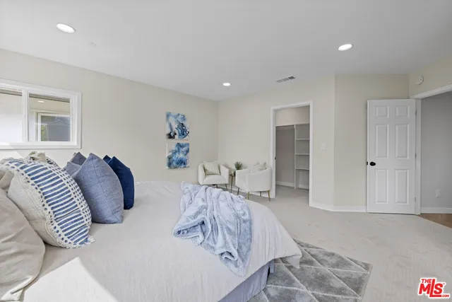 a bed room with a bed and a couch