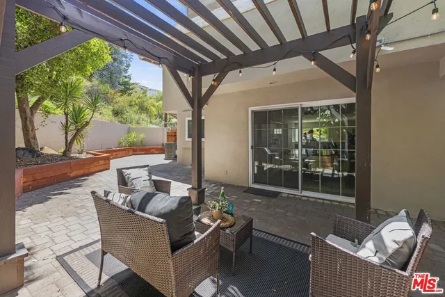 a view of yard with patio