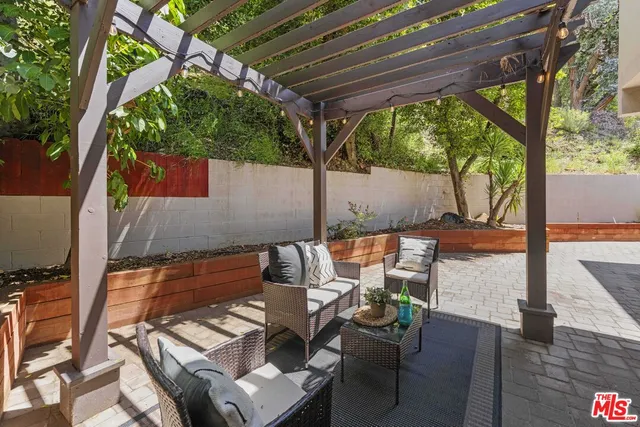 a house with lots of trees in the background