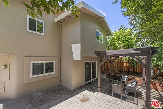 a potted plant sitting in front of a house