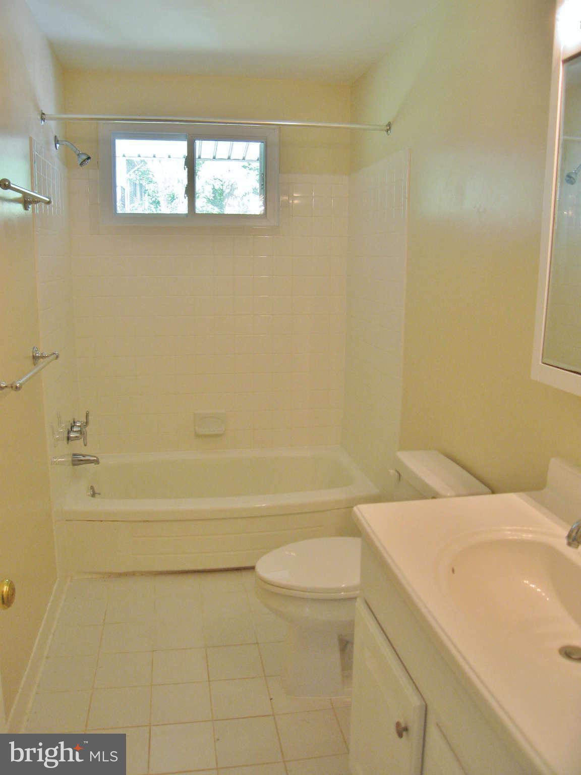 8113 Karl Road Alexandria, VA 22308 - Photo 12 of 15 a bathroom with a sink a toilet and shower