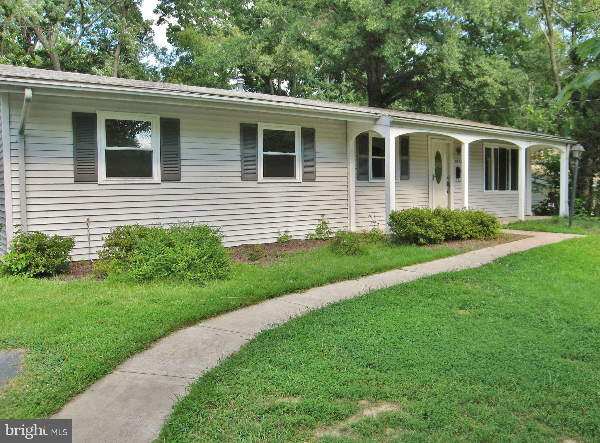 8113 Karl Road Alexandria, VA 22308 - Photo 14 of 15 a view of a house with a yard and a garden