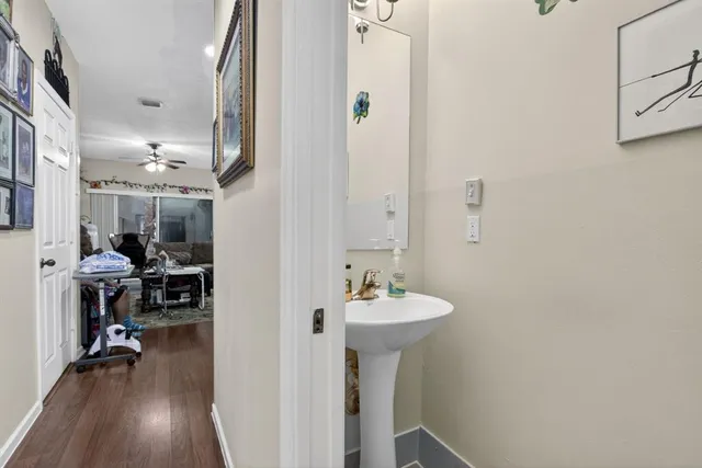 a bathroom with a sink a mirror and shower