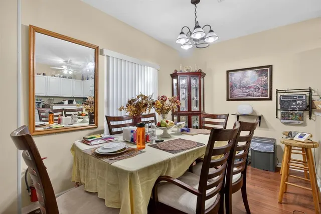 a view of a dining room with furniture and window