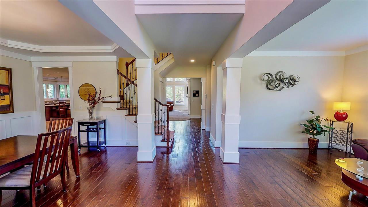 1309 Kintail Drive Raleigh, NC 27613 - Photo 4 of 30 Foyer features views of your formal dining and living rooms, and a grand double staircase with beautiful iron spindles and upgraded hardwood flooring on 1st floor, crown molding throughout the home. Foyer