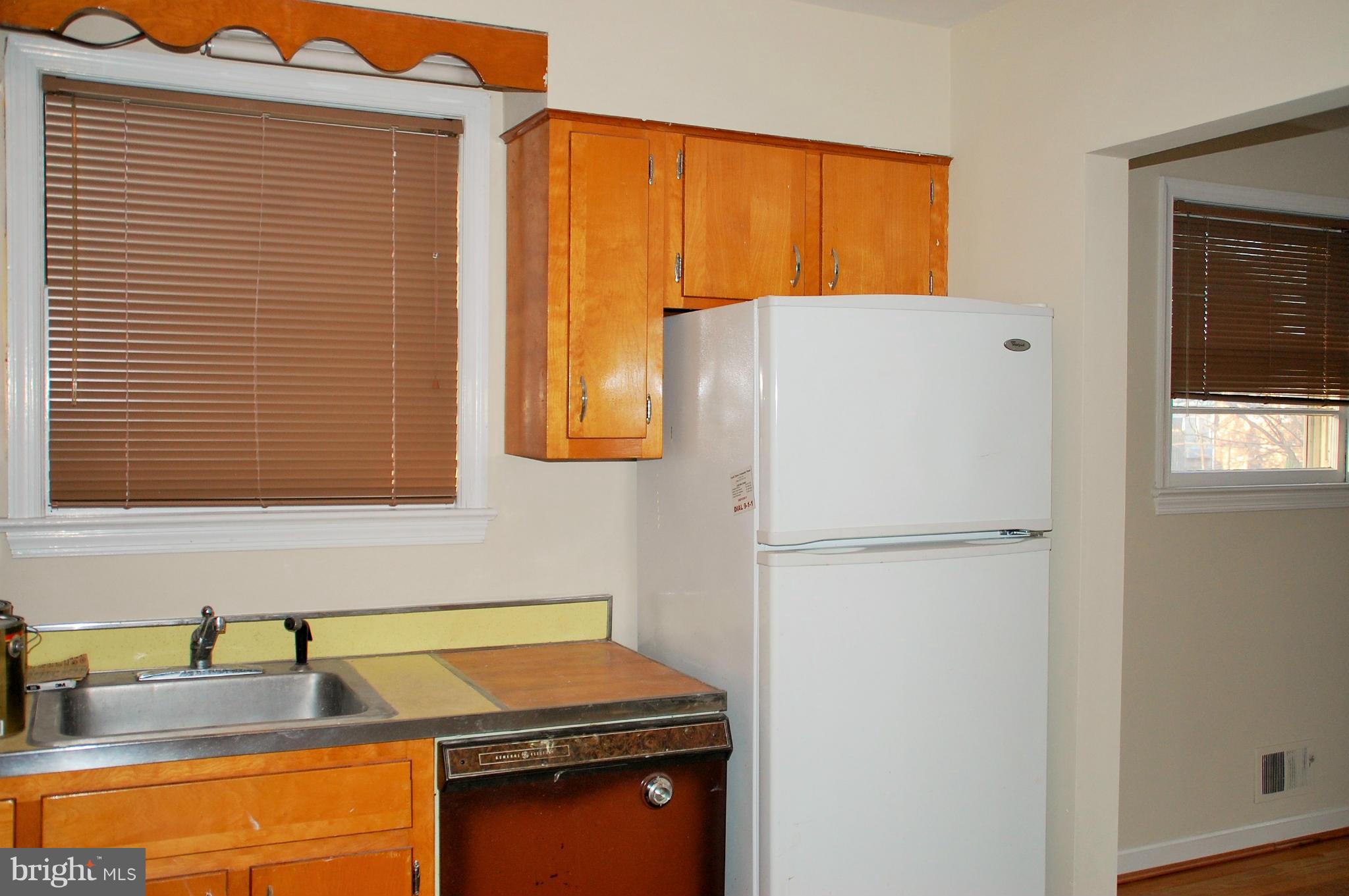 5508 Spruce Drive Clinton, MD 20735 - Photo 6 of 18 a kitchen with refrigerator and window