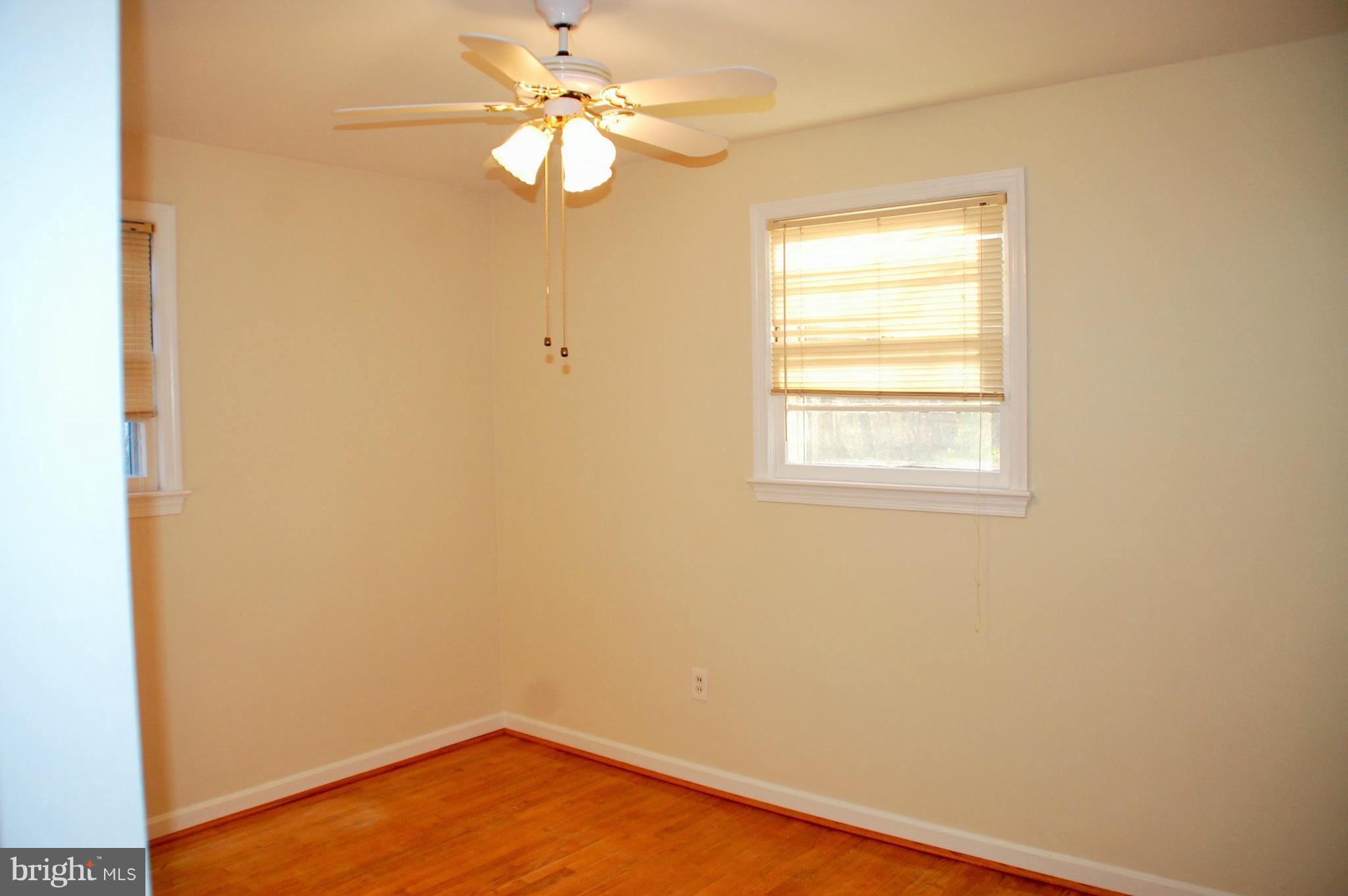 5508 Spruce Drive Clinton, MD 20735 - Photo 8 of 18 an empty room with a window and a fan
