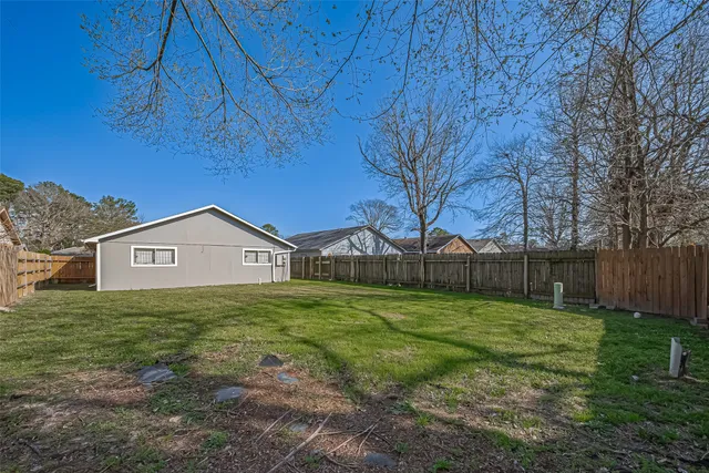 a view of a backyard of the house