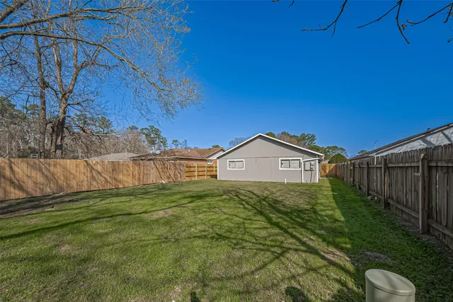 a view of a back yard of the house