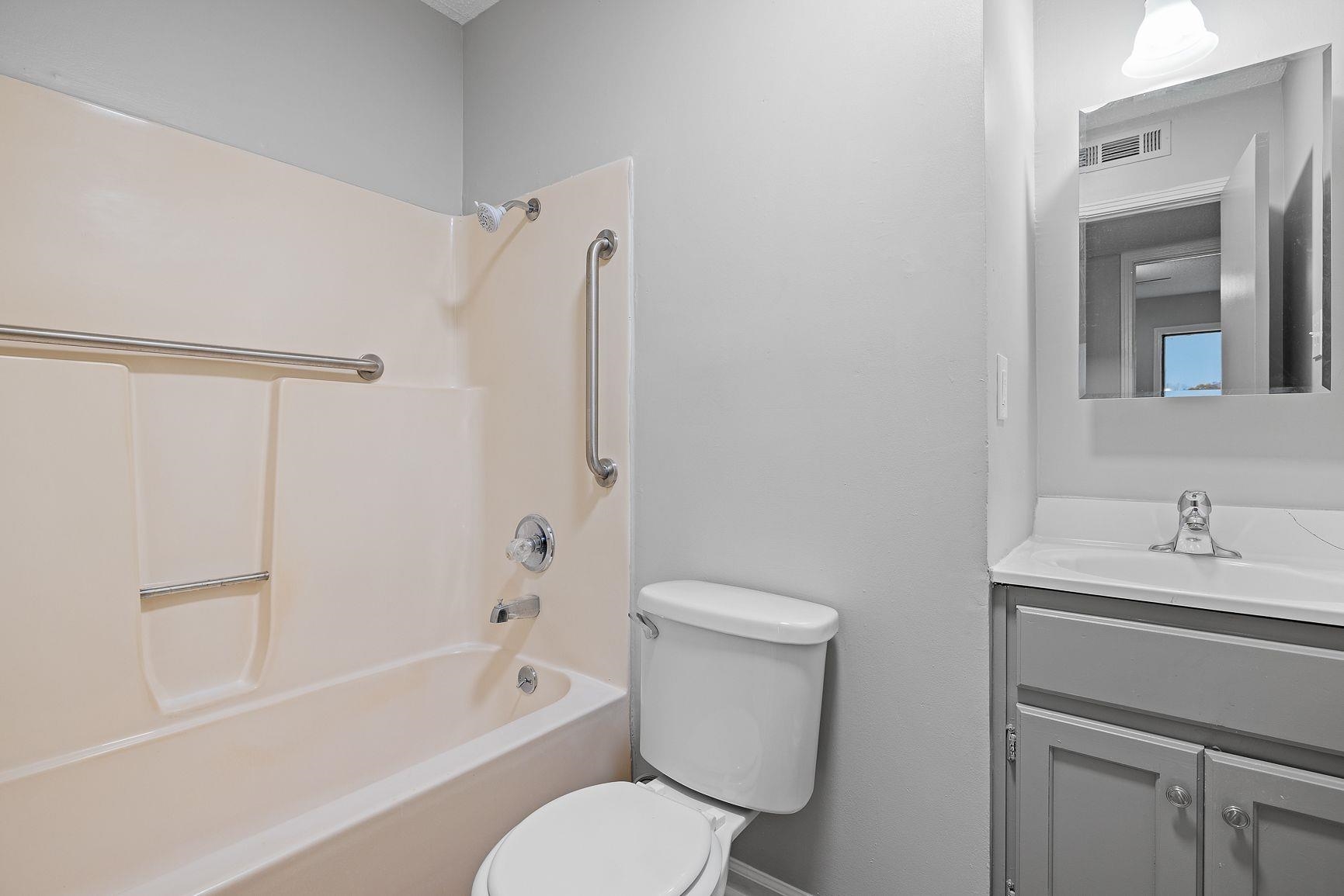267 Ervin Lane Covington, TN 38019 - Photo 17 of 23 a white toilet sitting next to a bath tub