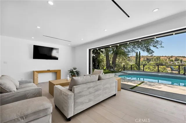 a living room with fireplace furniture and a flat screen tv