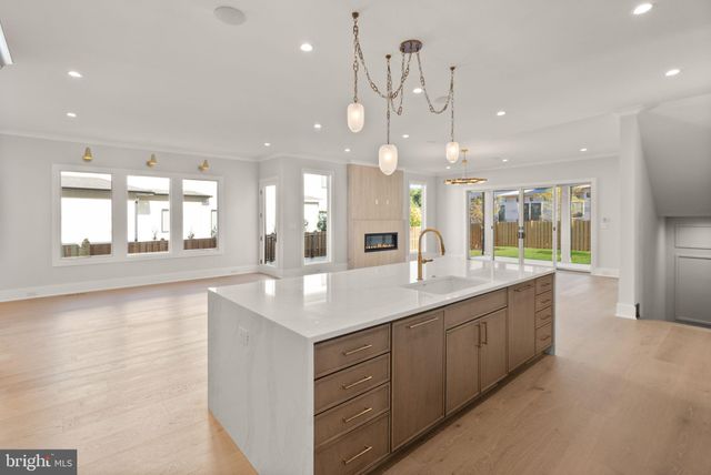 a large bathroom with a large mirror vanity and sink